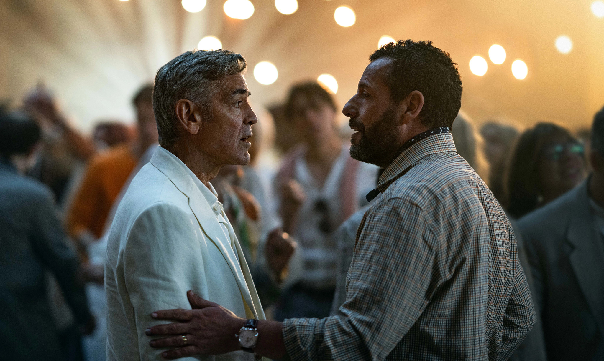 george clooney and adam sandler in a scene from jay kelly