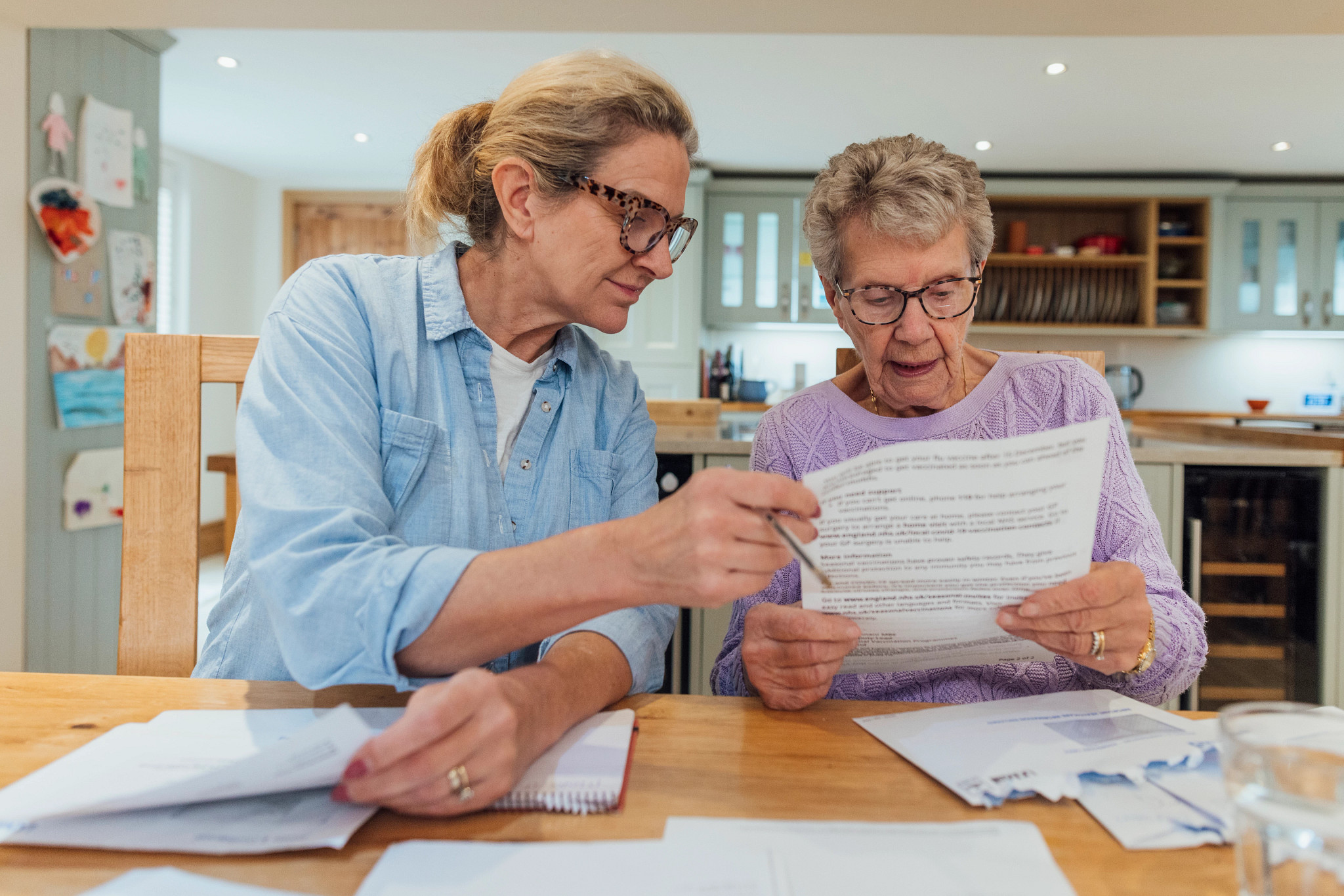 two people looking at paperwork