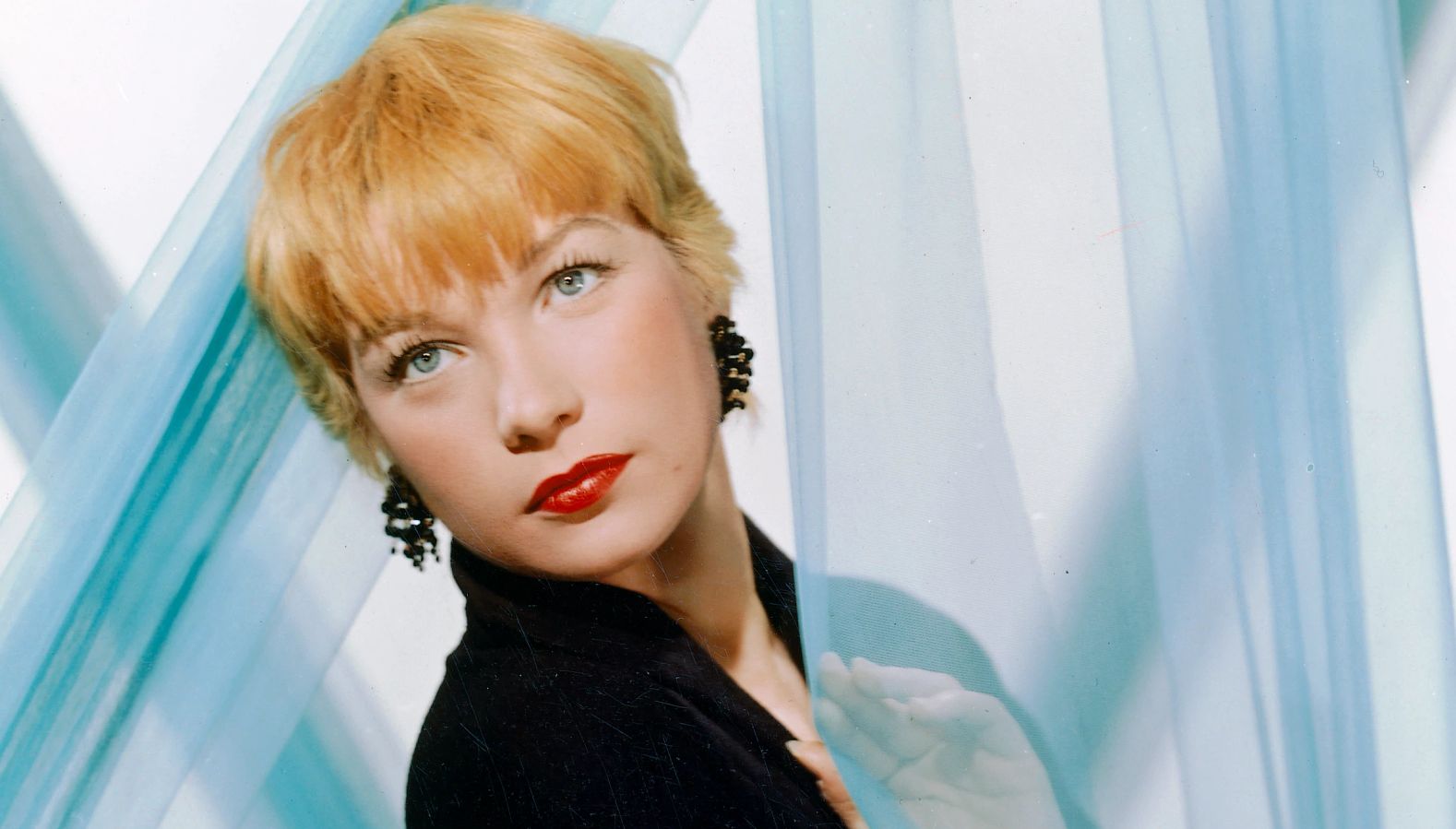 Actress Shirley MacLaine posing for a portrait