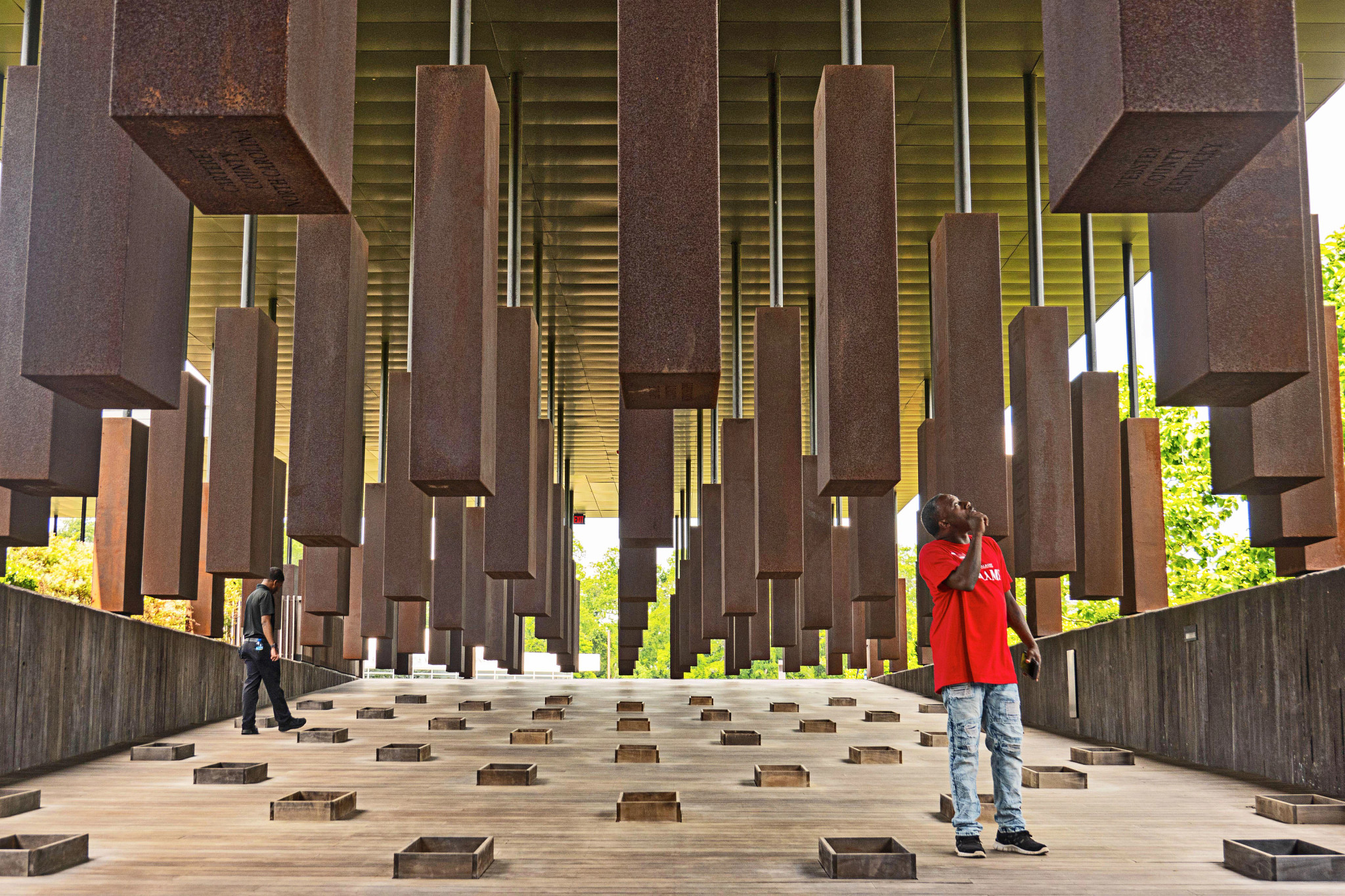 two men observing the steel monuments