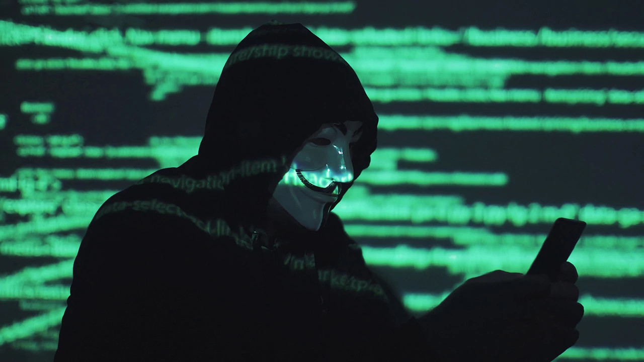 a scammer wearing a mask