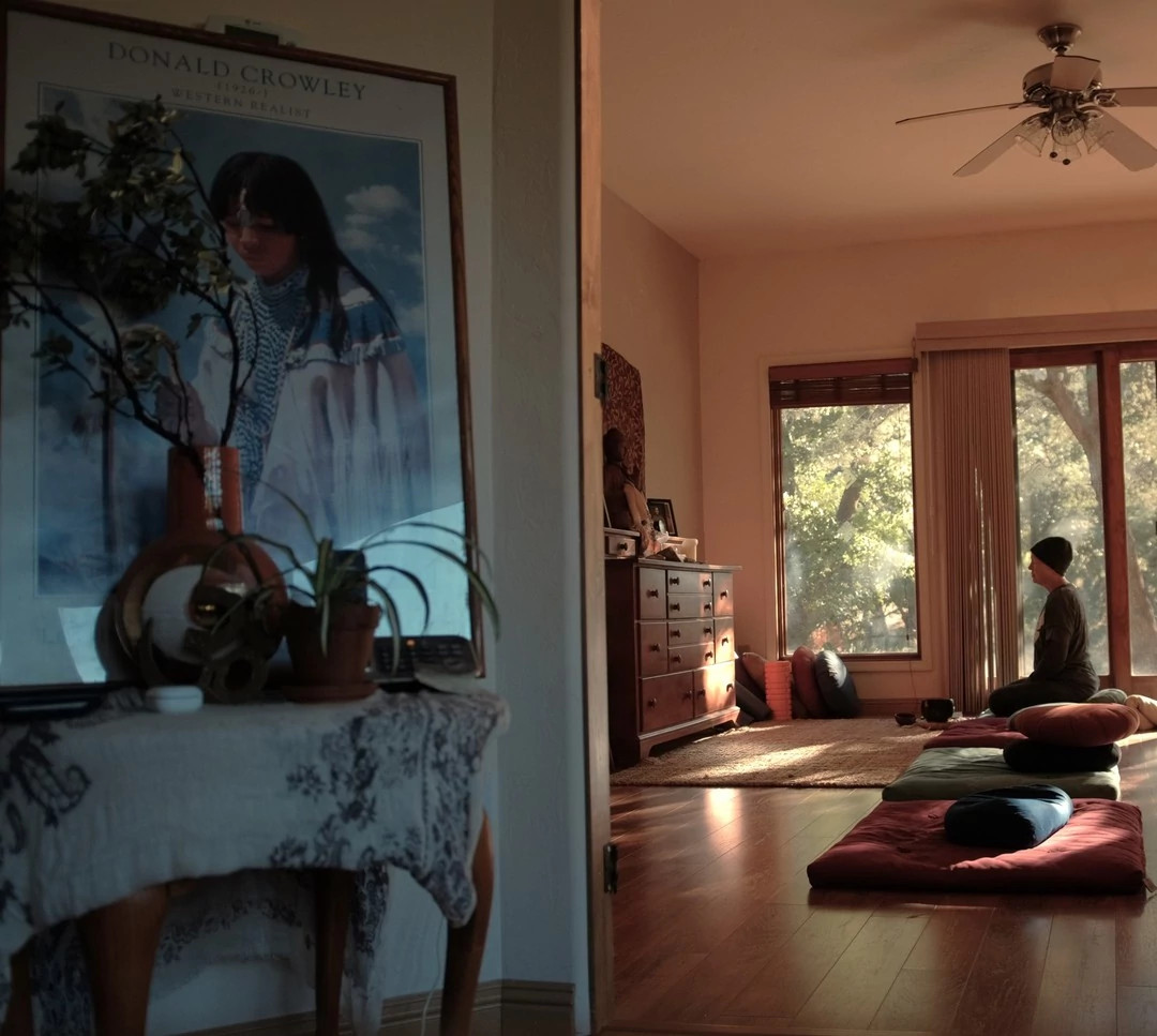 a person on a mat in their room at the Dharma Treasure Retreat Center