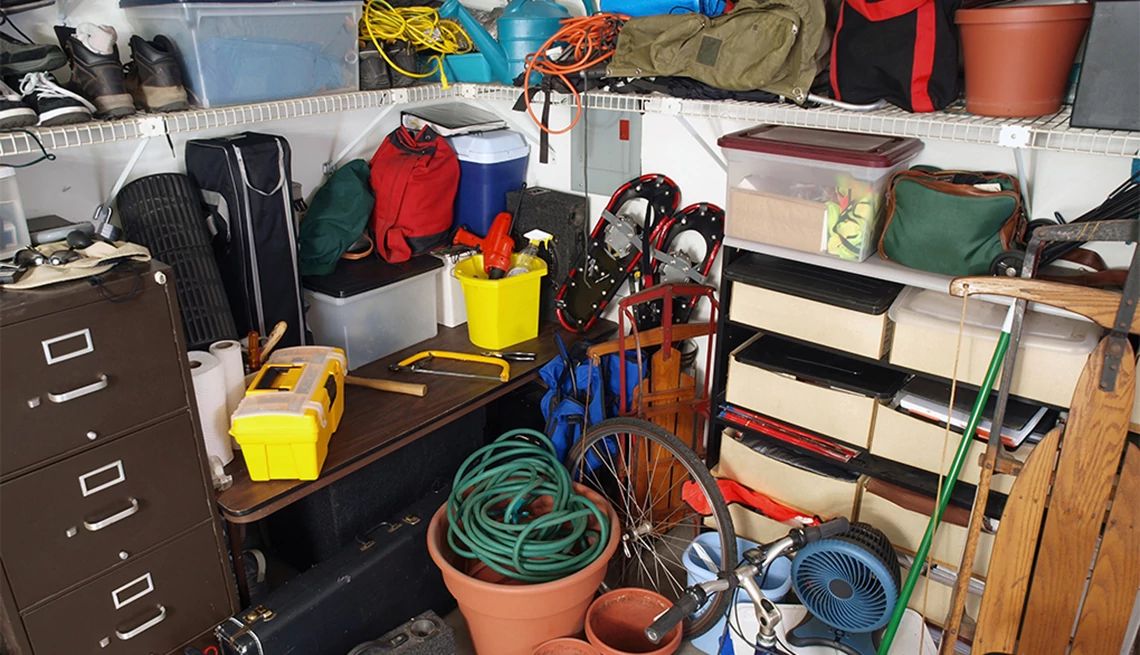 Too many belongings in your living space can undermine your well-being and cause stress A cluttered area of a person's home