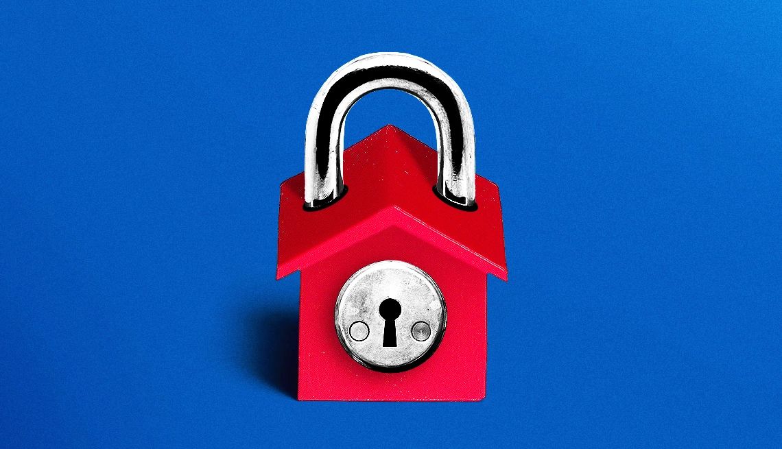 a red lock in the shape of a house