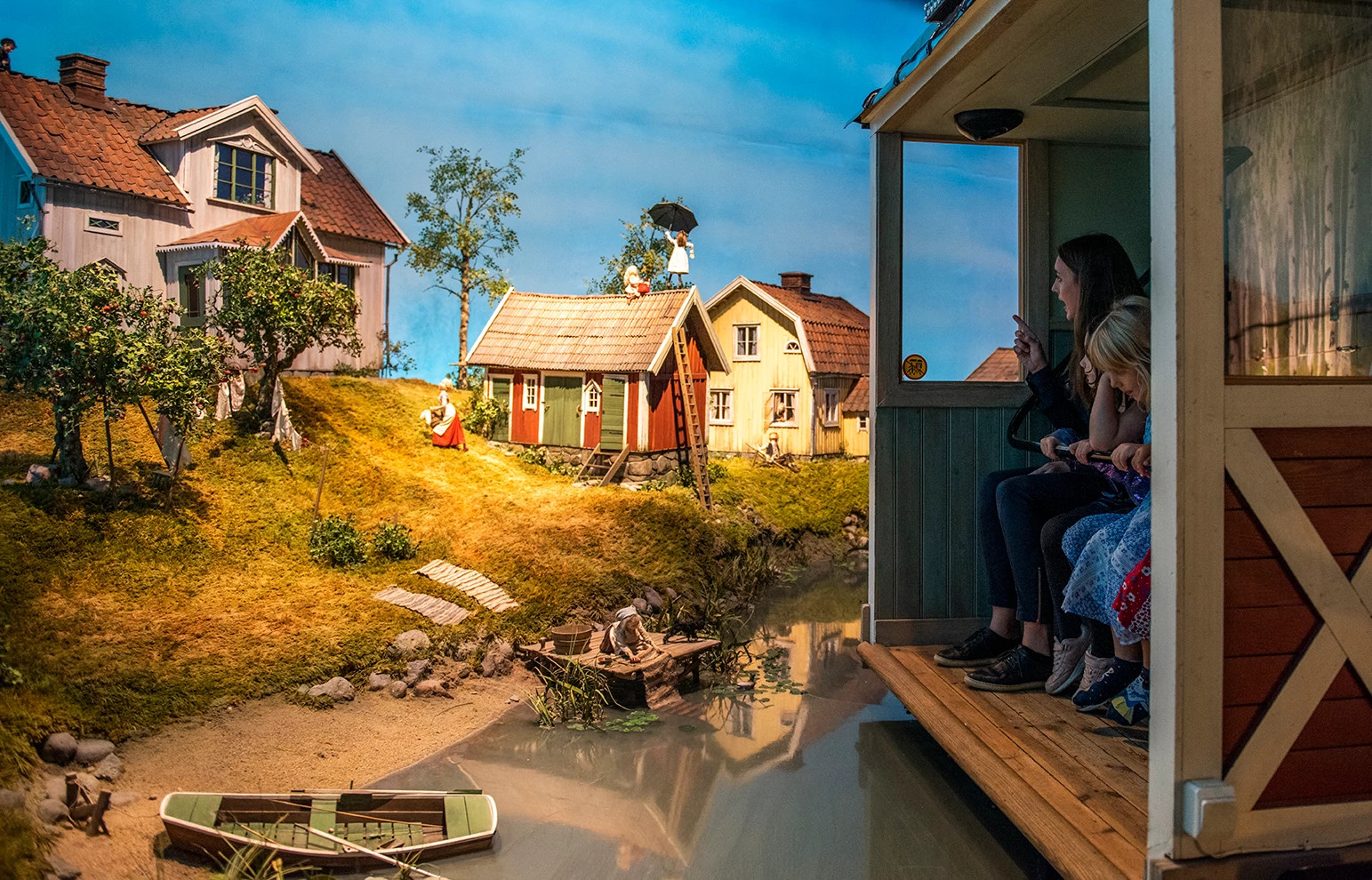 a family on an amusement park ride in stockholm