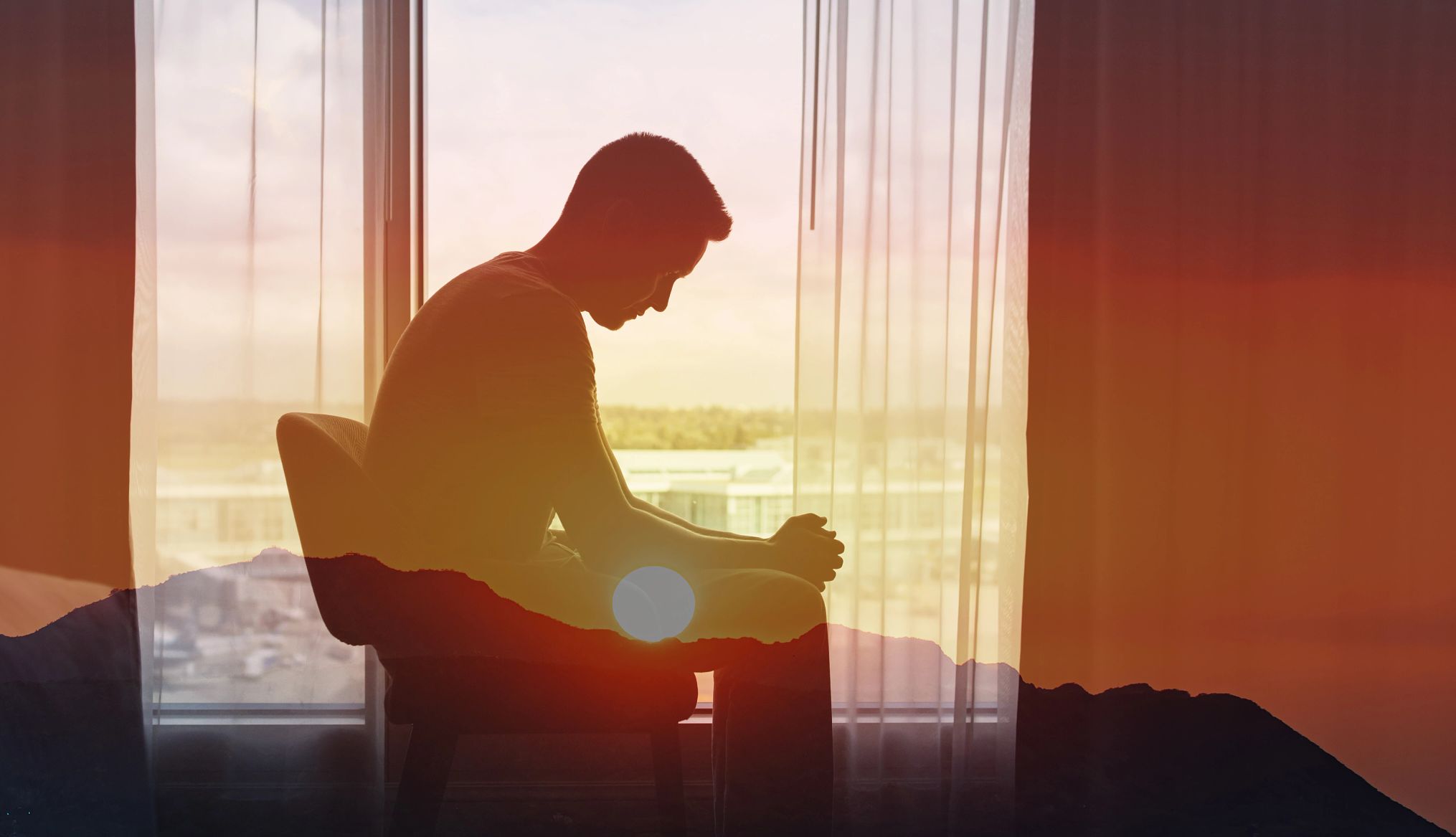 AARP Addresses Loneliness Epidemic sad man sitting alone in the dark room