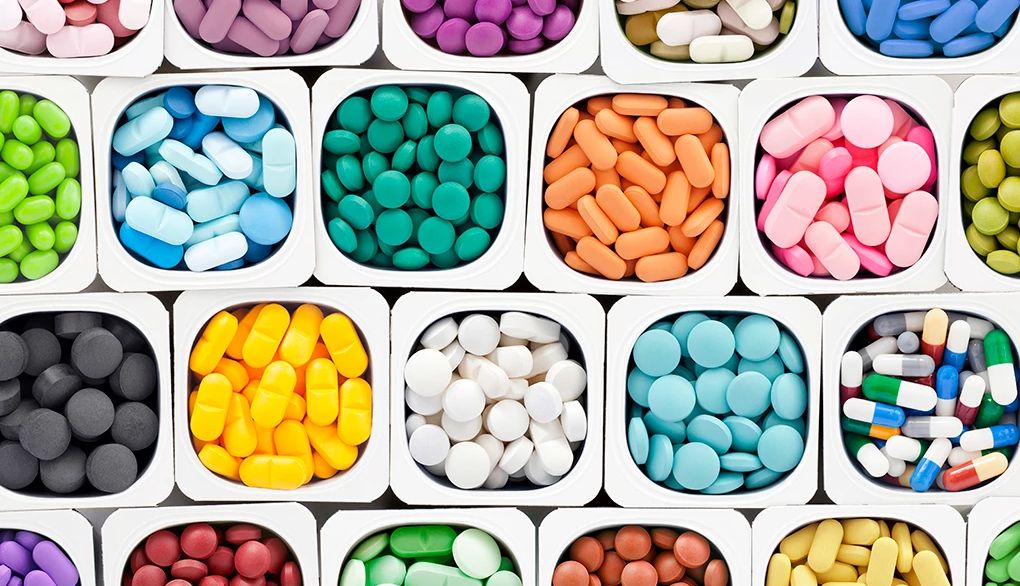 Supplements have been studied to see if they help brain health A variety of multicolored brain health supplement pills inside plastic containers