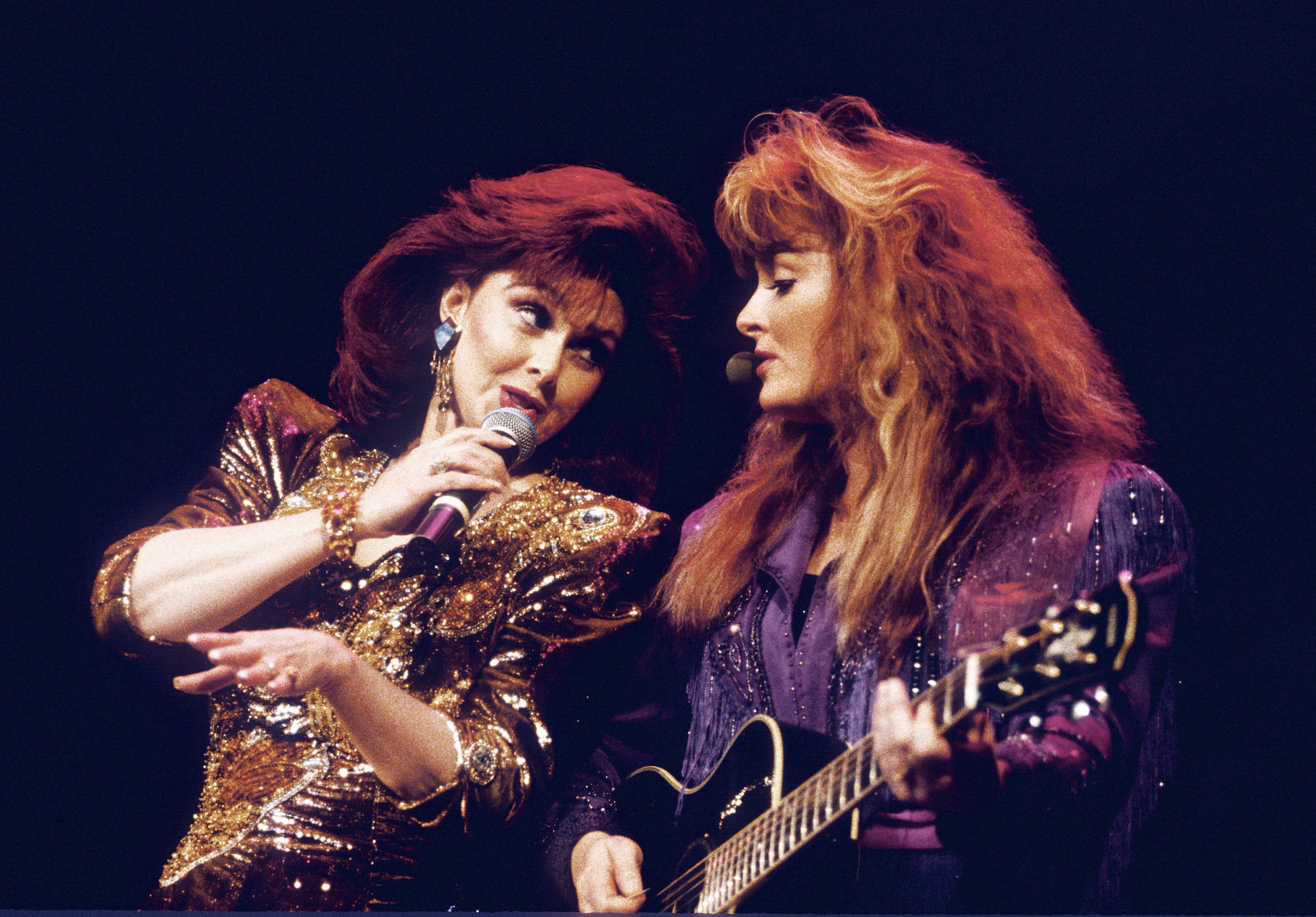 Wynonna Judd and Naomi Judd performing together in 1985.