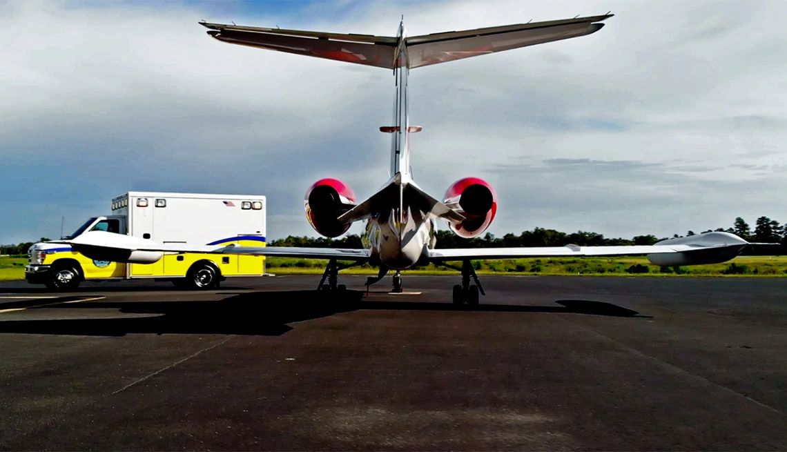 Image of ambulance meeting a private jet at the airport