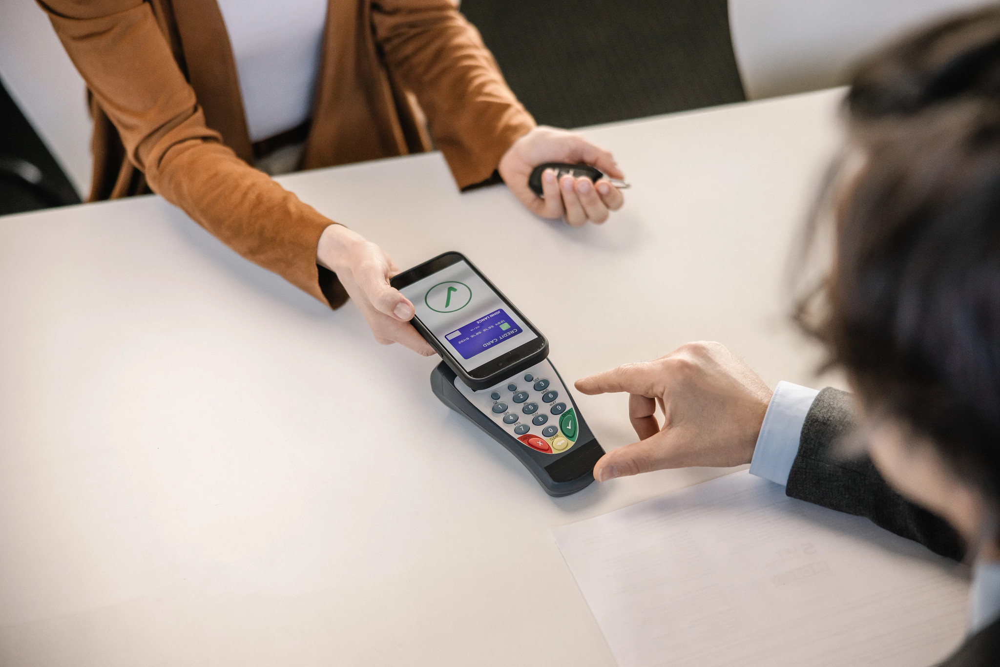 a person paying using a credit card on their phone