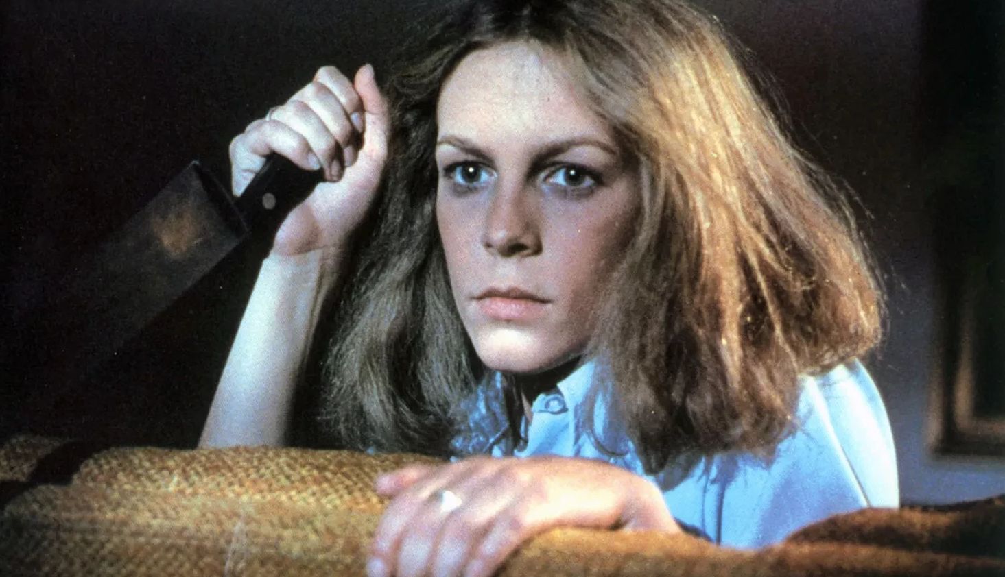 The Liberation of Jamie Lee Curtis jamie lee curtis clutching a knife in a still image from 'halloween'