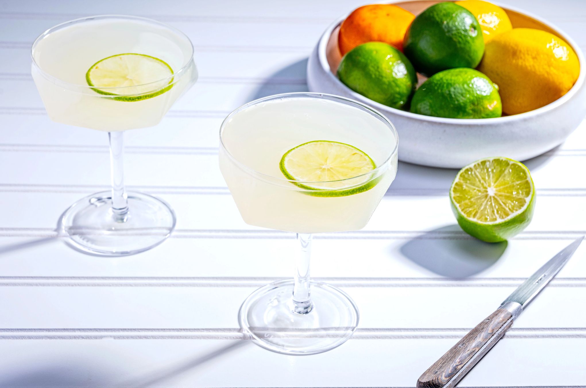 This recipe yields 1 gallon of Margarita two glasses of margaritas on a table