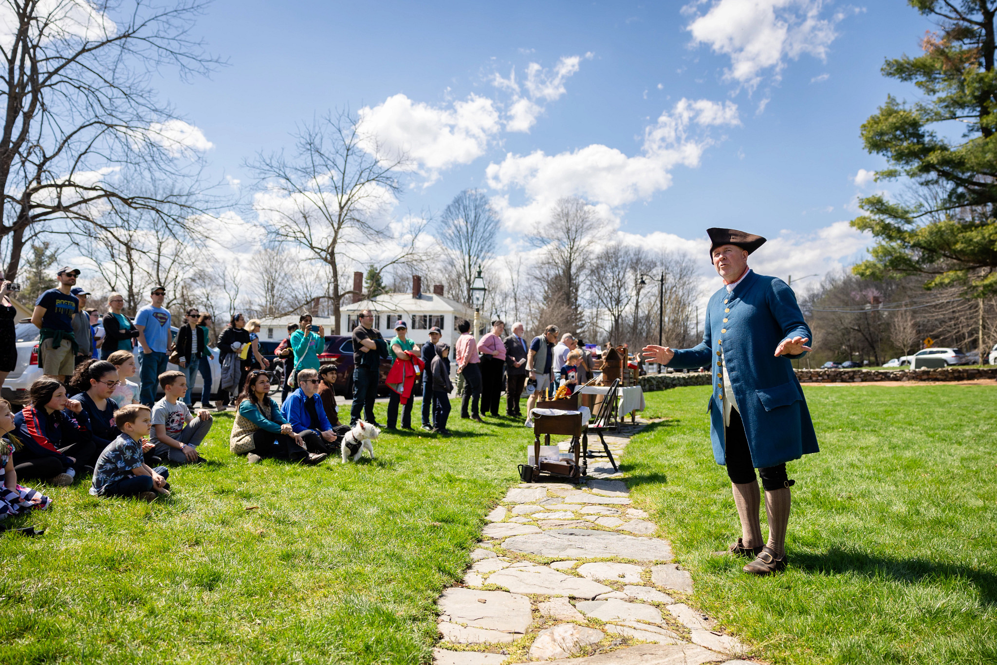 an American Revolutionary War reenactor speaks to a crowd