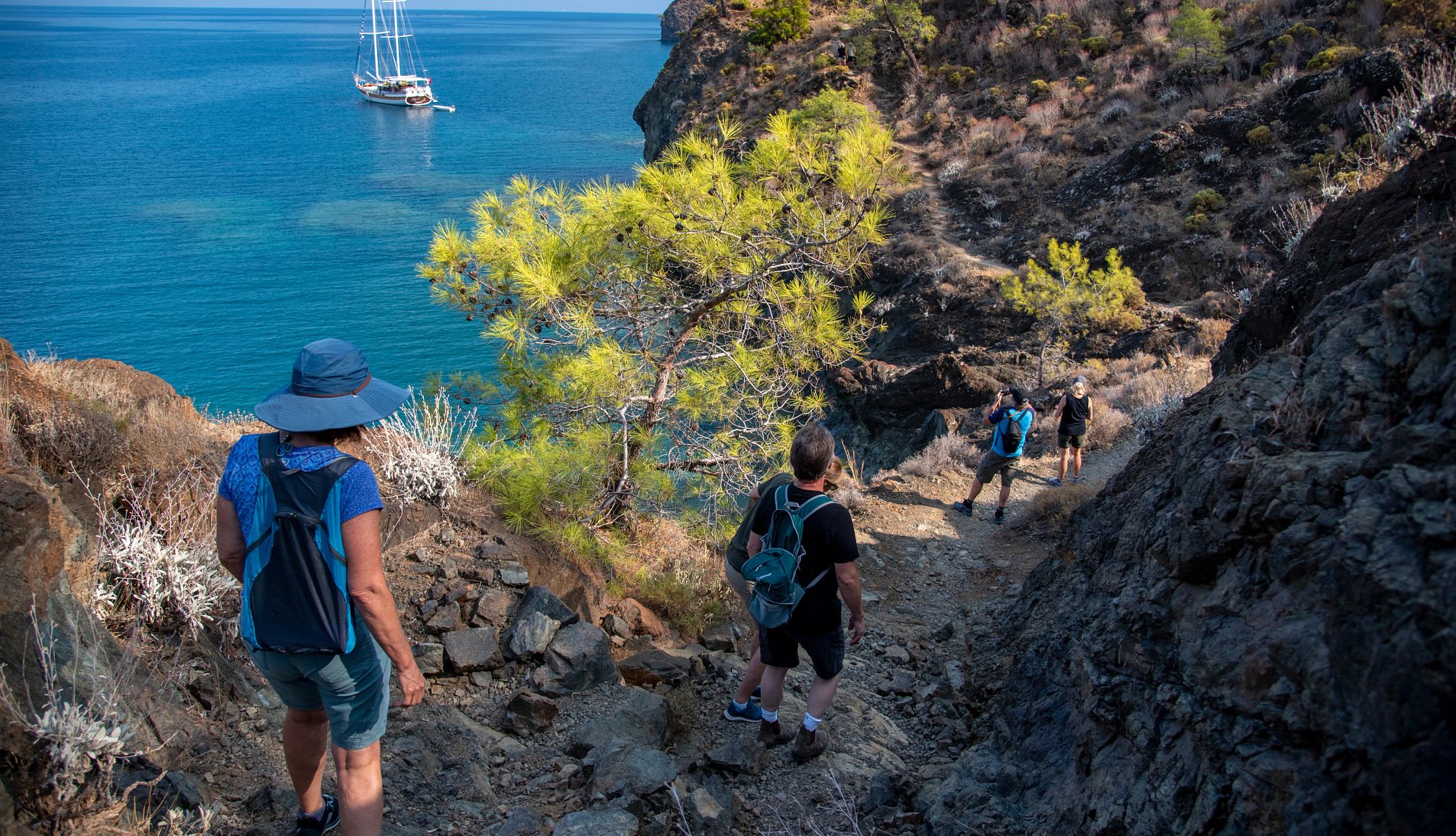 Be sure to bring extra water if hiking in the heat a group of hikers