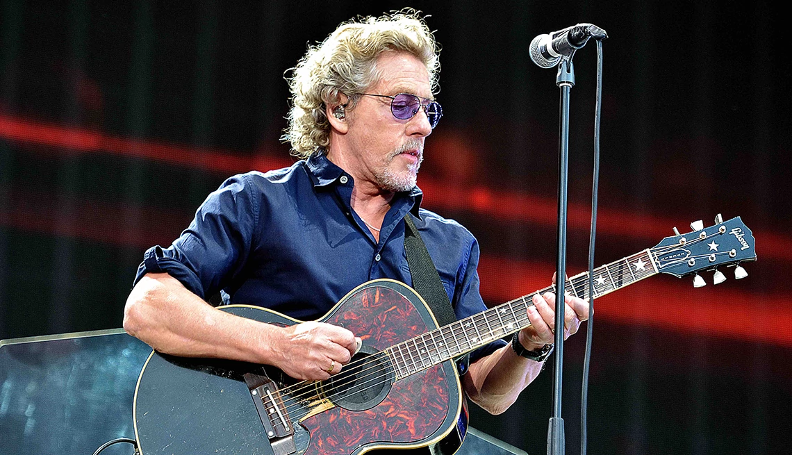 Roger Daltrey Roger Daltrey playing an acoustic onstage during a performance