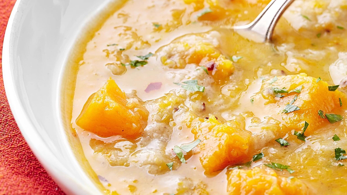 A close-up view of creamy rye and butternut squash soup in a bowl