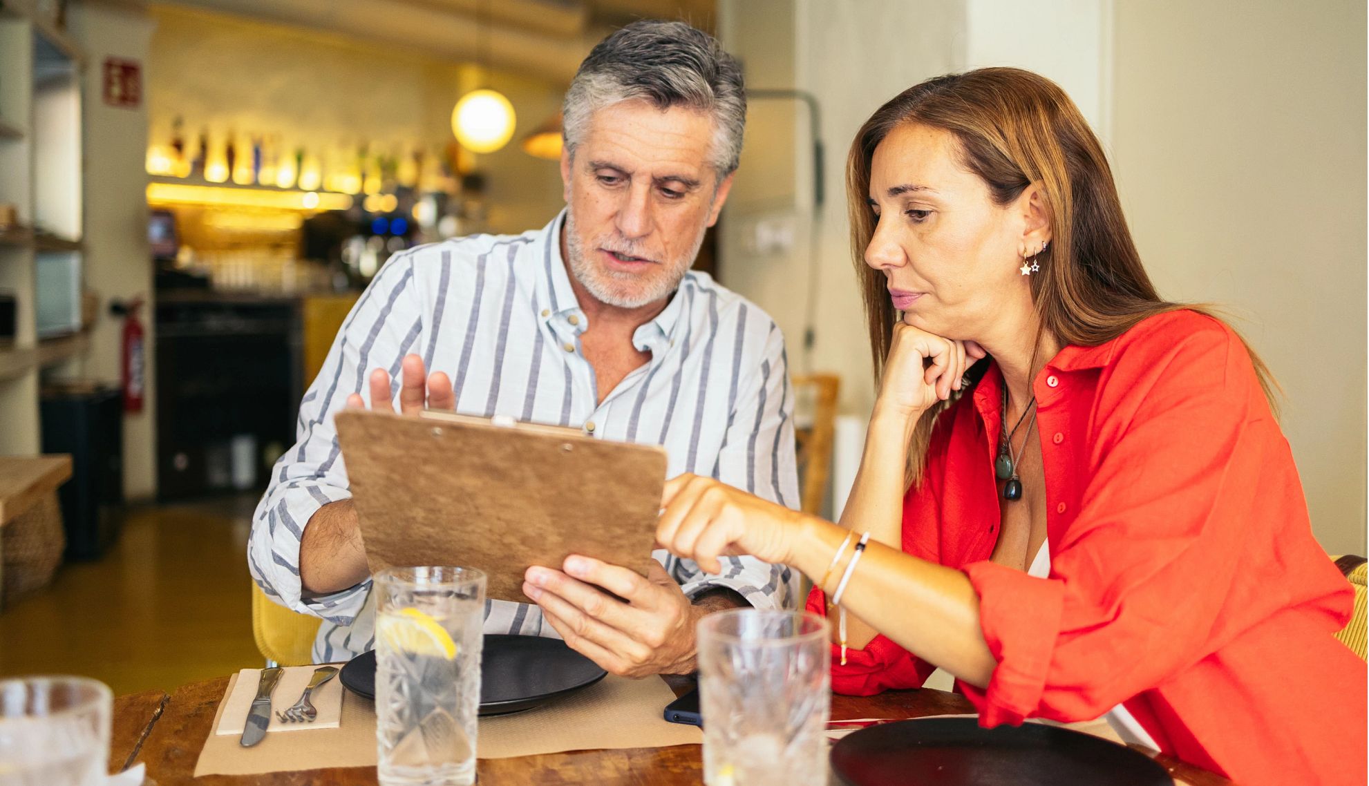 How to Avoid Food Poisoning couple looking at a menu