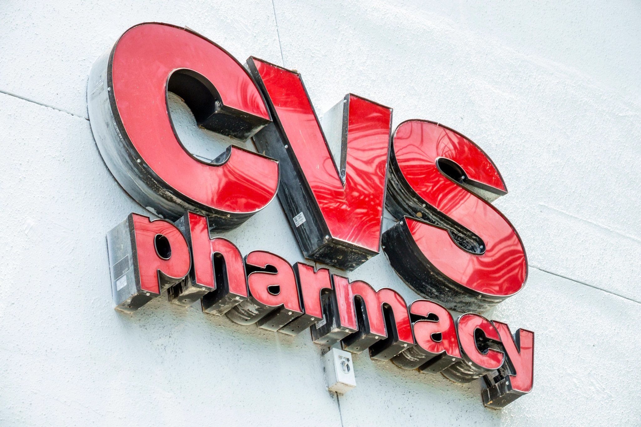 CVS Pharmacy signage on a concrete wall