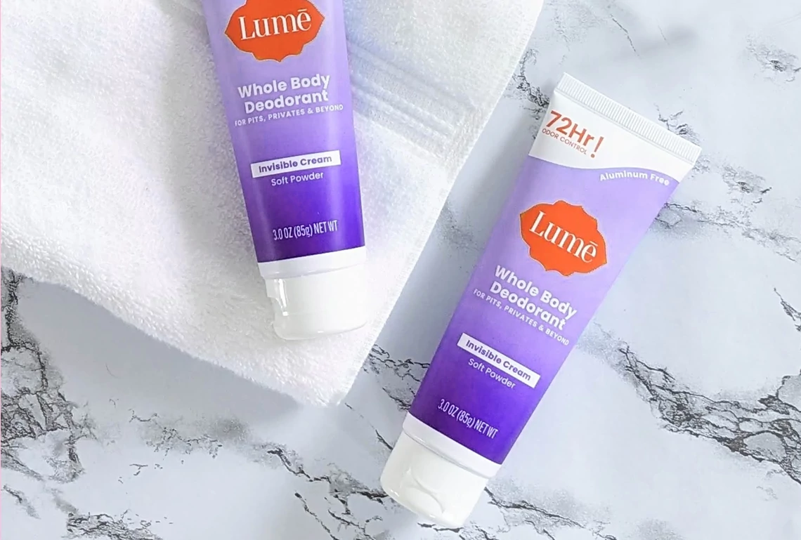 Two bottles of Lume whole body deodorant lying next to each other