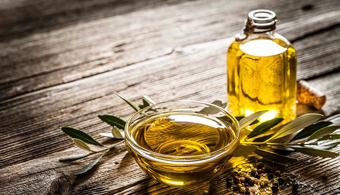 Extra-Virgin Olive Oil A close-up view of olive oil in a glass bowl and bottle