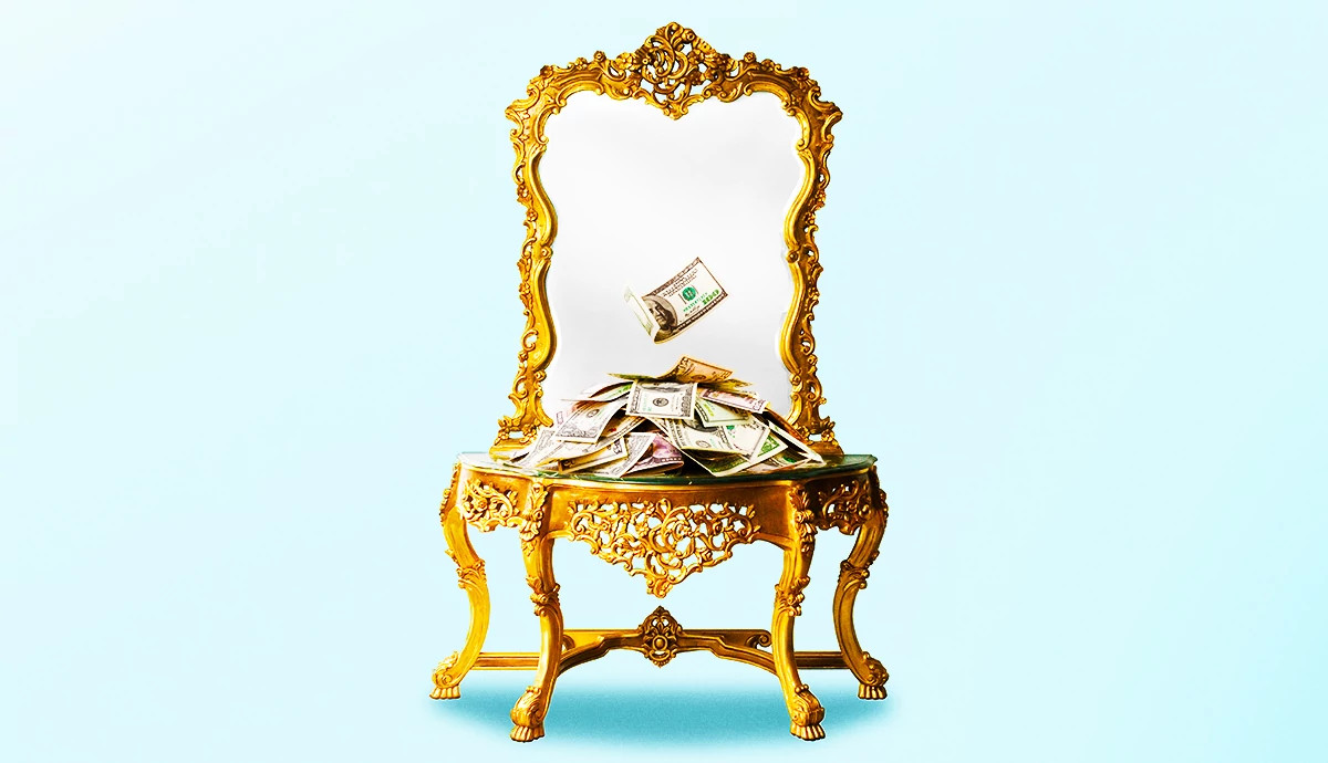 a photo and graphic illustration shows an antique table and mirror with cash piled atop it