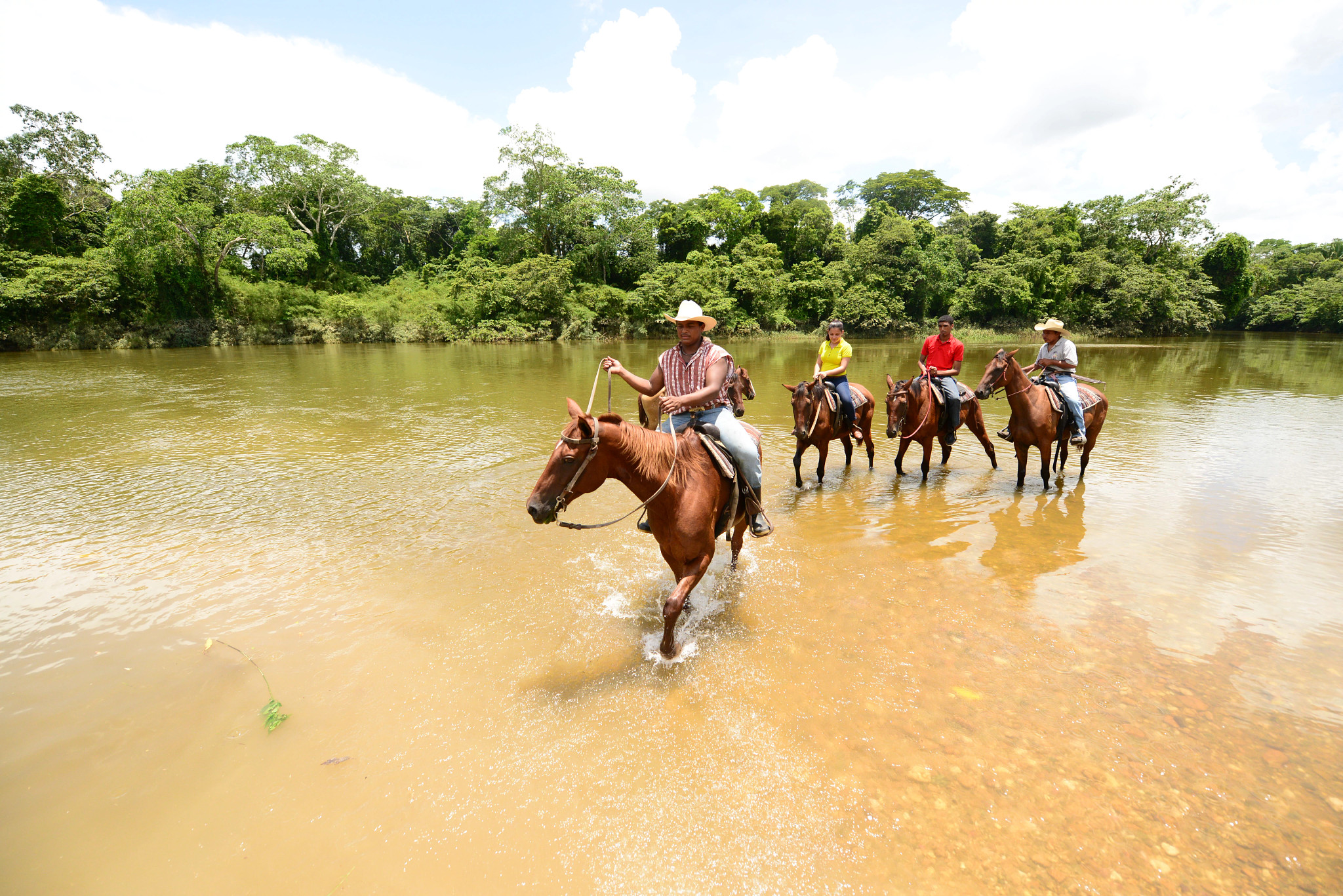 travelers on horseback in Belize