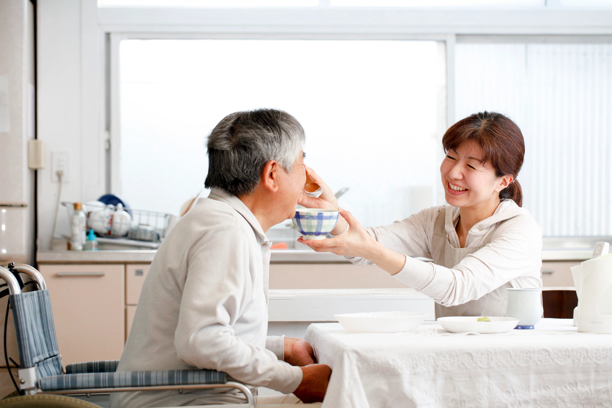 one person feeding another