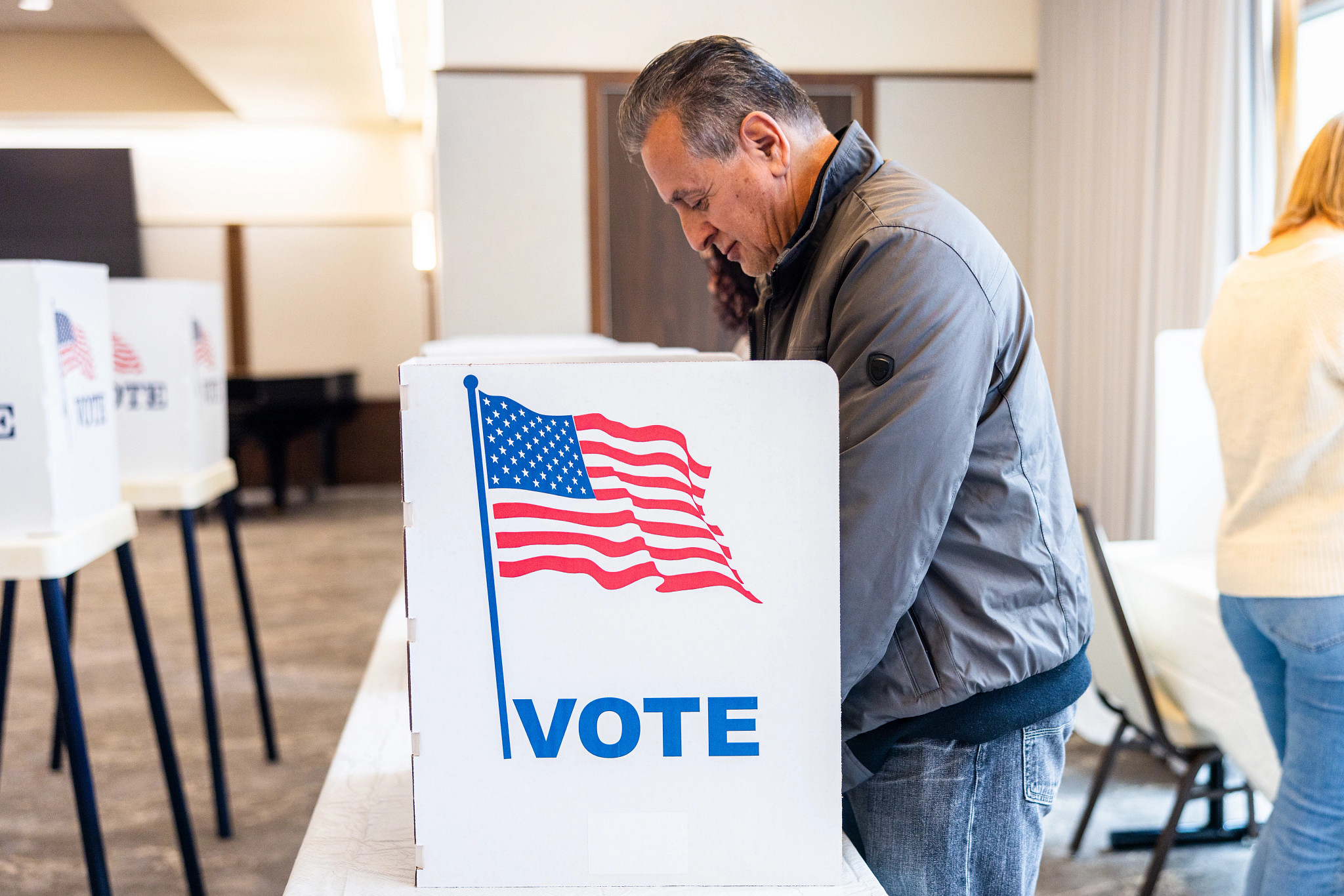 a man in a voting booth
