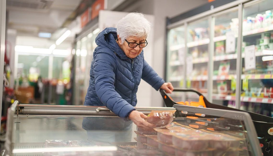 What you eat may affect the tiny-yet-mighty microbes in your gut A woman checking the label of a product in a grocery store