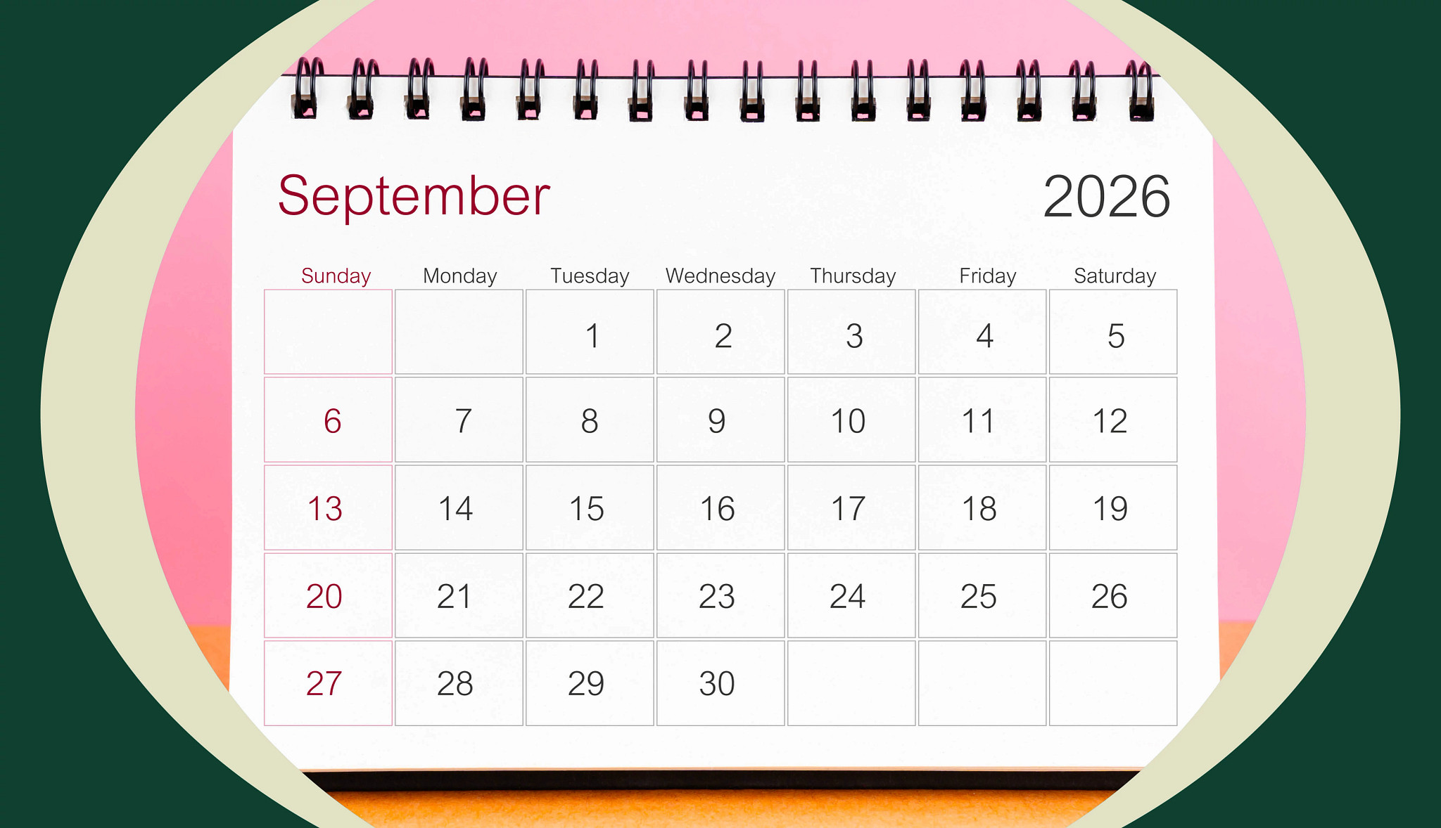 Spiral-bound September 2026 calendar displayed against a colorful background, representing a Couch to Fit wellness challenge