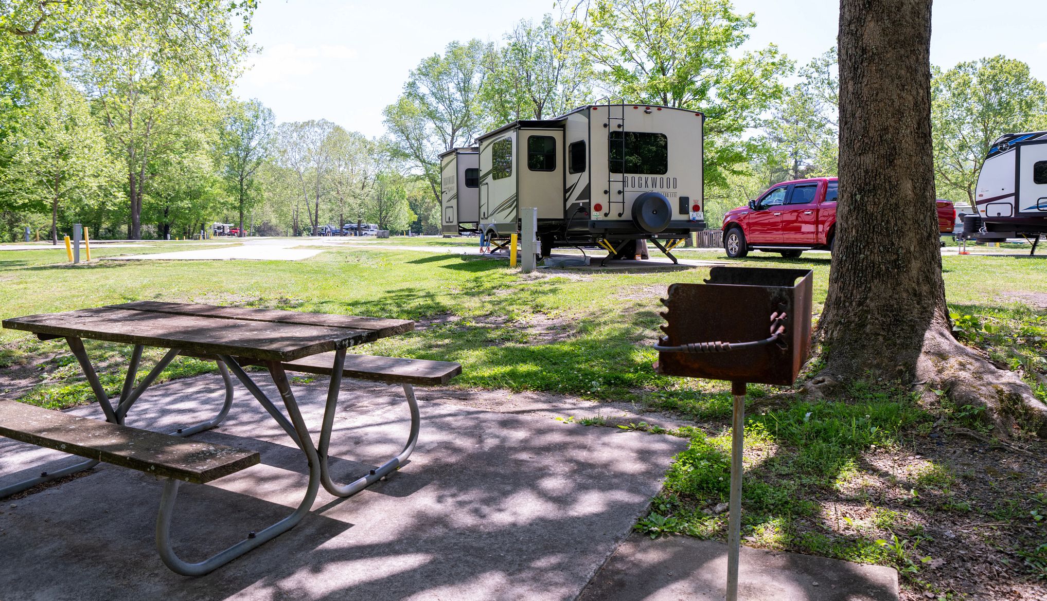 Campgrounds Near Scenic Drives a picnic table near an rv at a campground