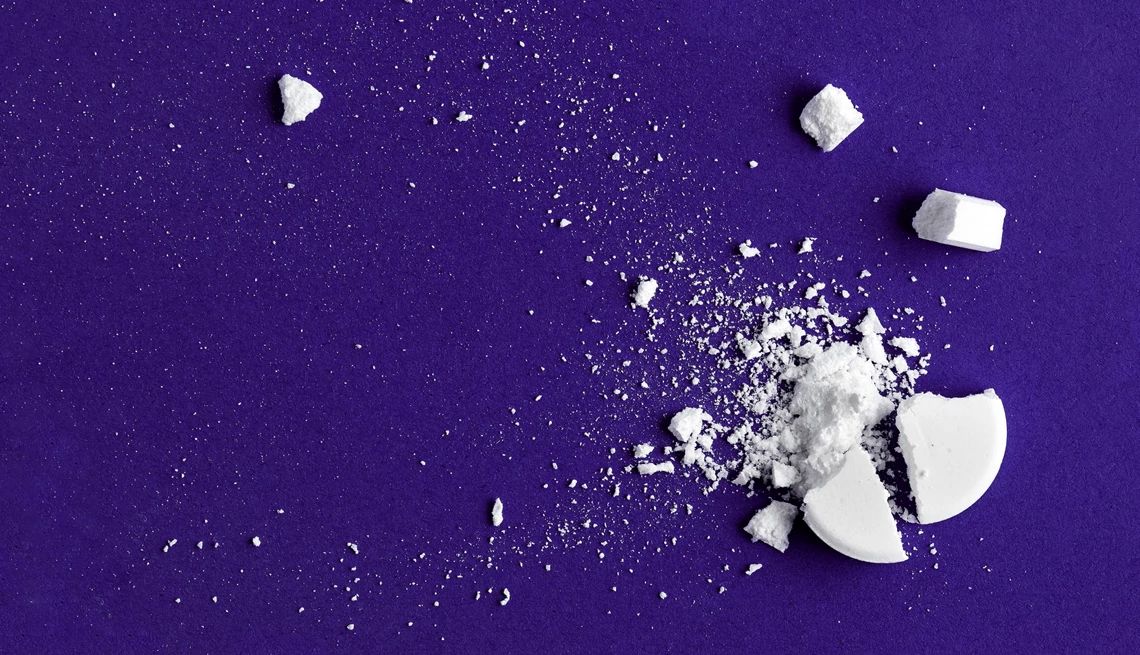 DES Health Effects crushed pill on blue background