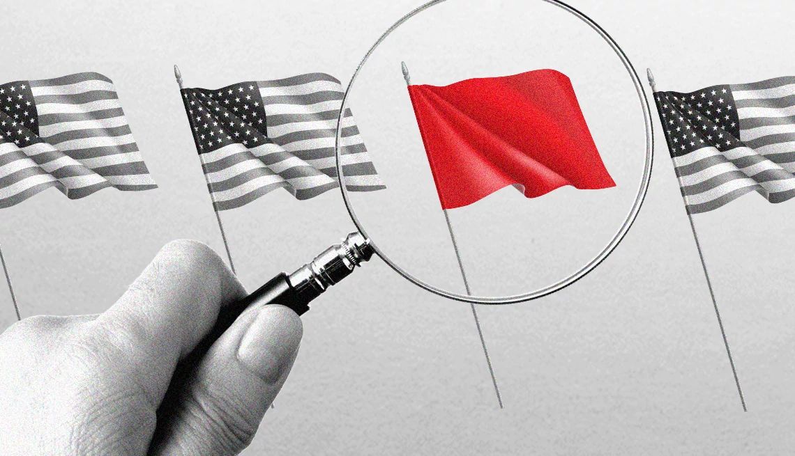 a series of american flags with one red flag under a magnifying glass