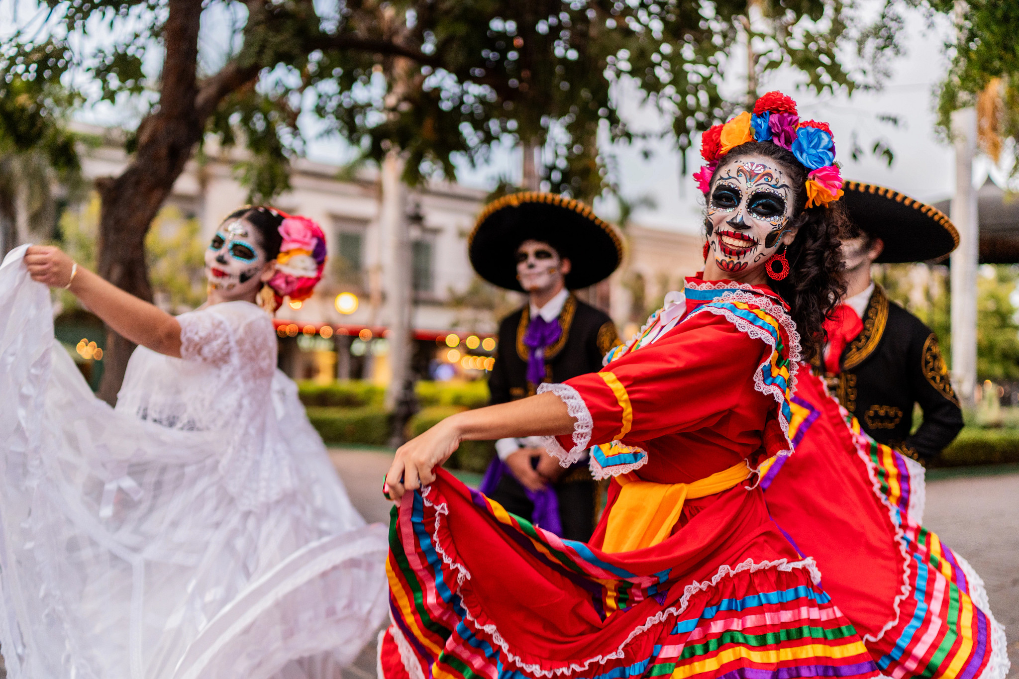 people dancing in colorful dressess