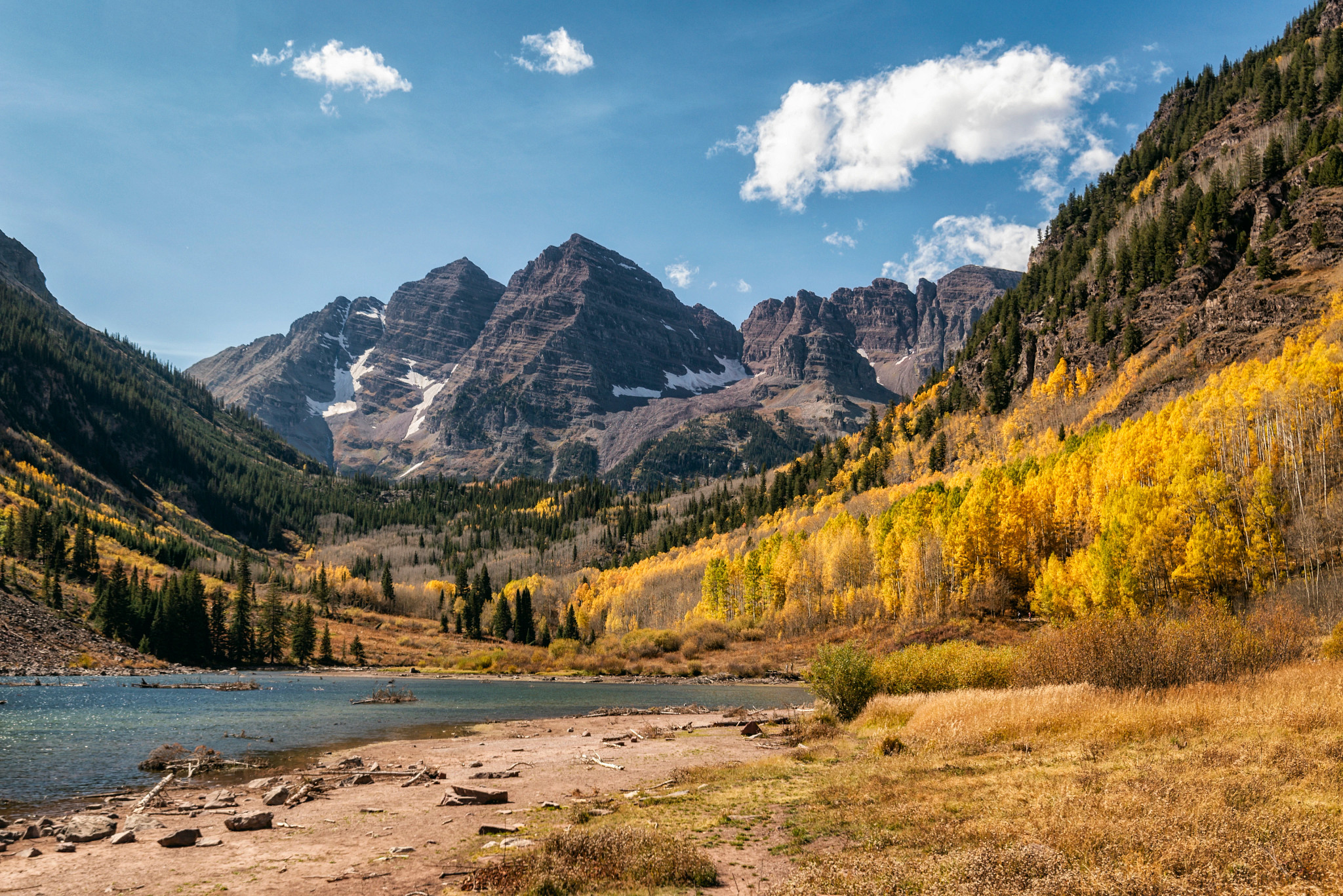 a lake, forest and mountains