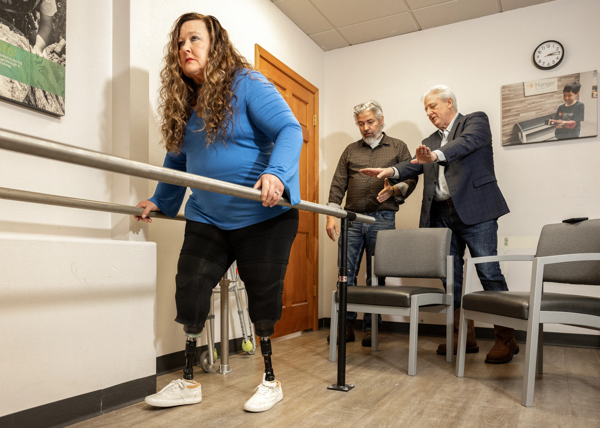 a person going through rehab with people behind them