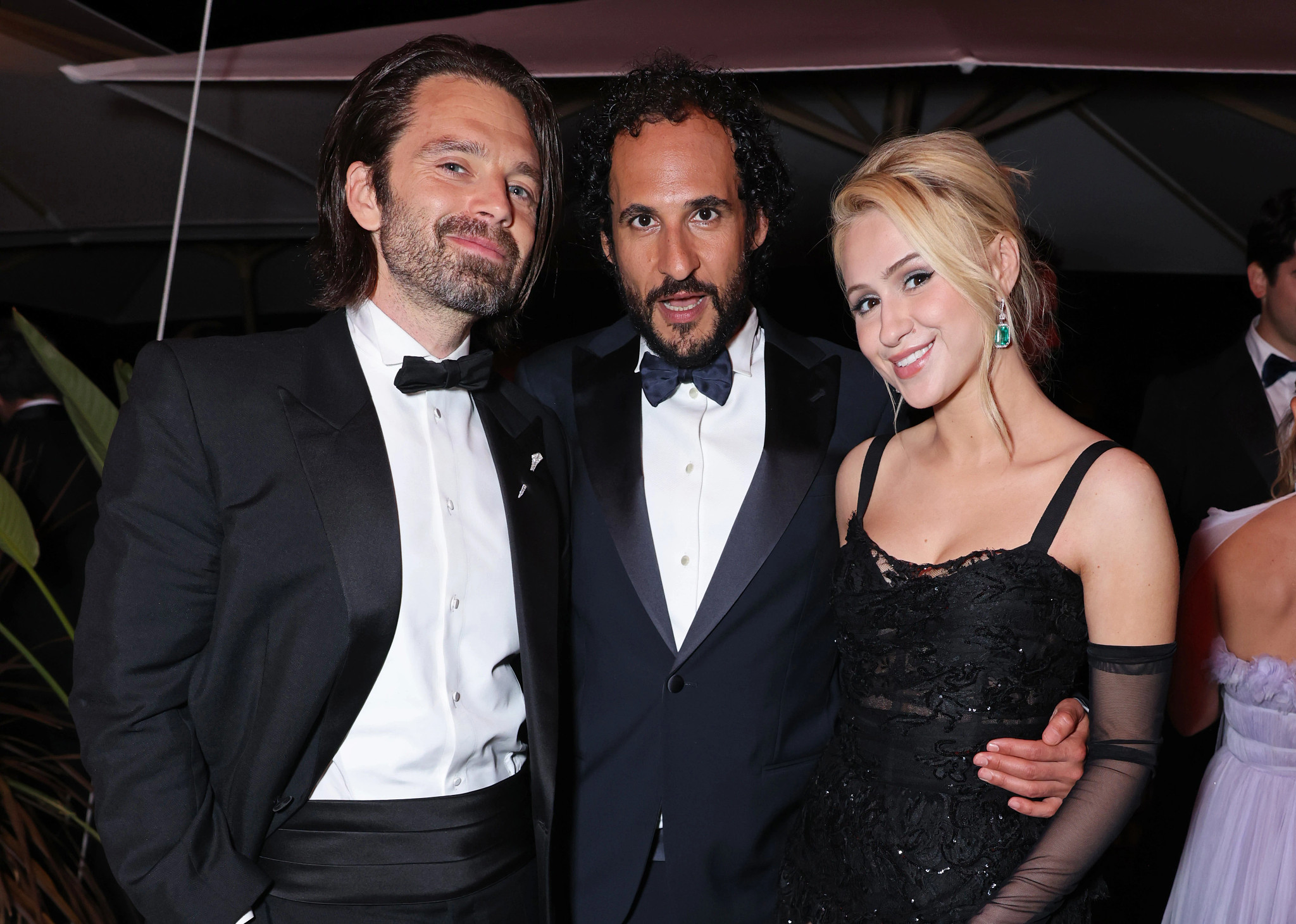 Sebastian Stan, Ali Abbasi and Maria Bakalova attend "The Apprentice" after-party at the 77th Cannes Film Festival