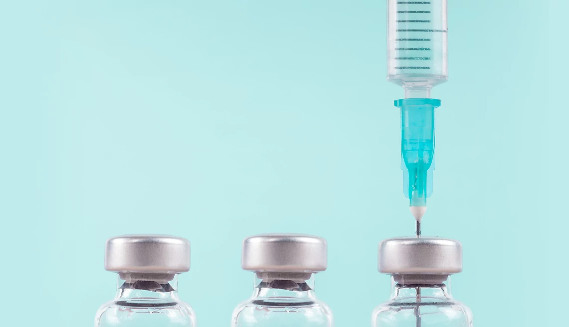 Medicare Enrollees Receive Free Vaccines syringe and vaccine bottles