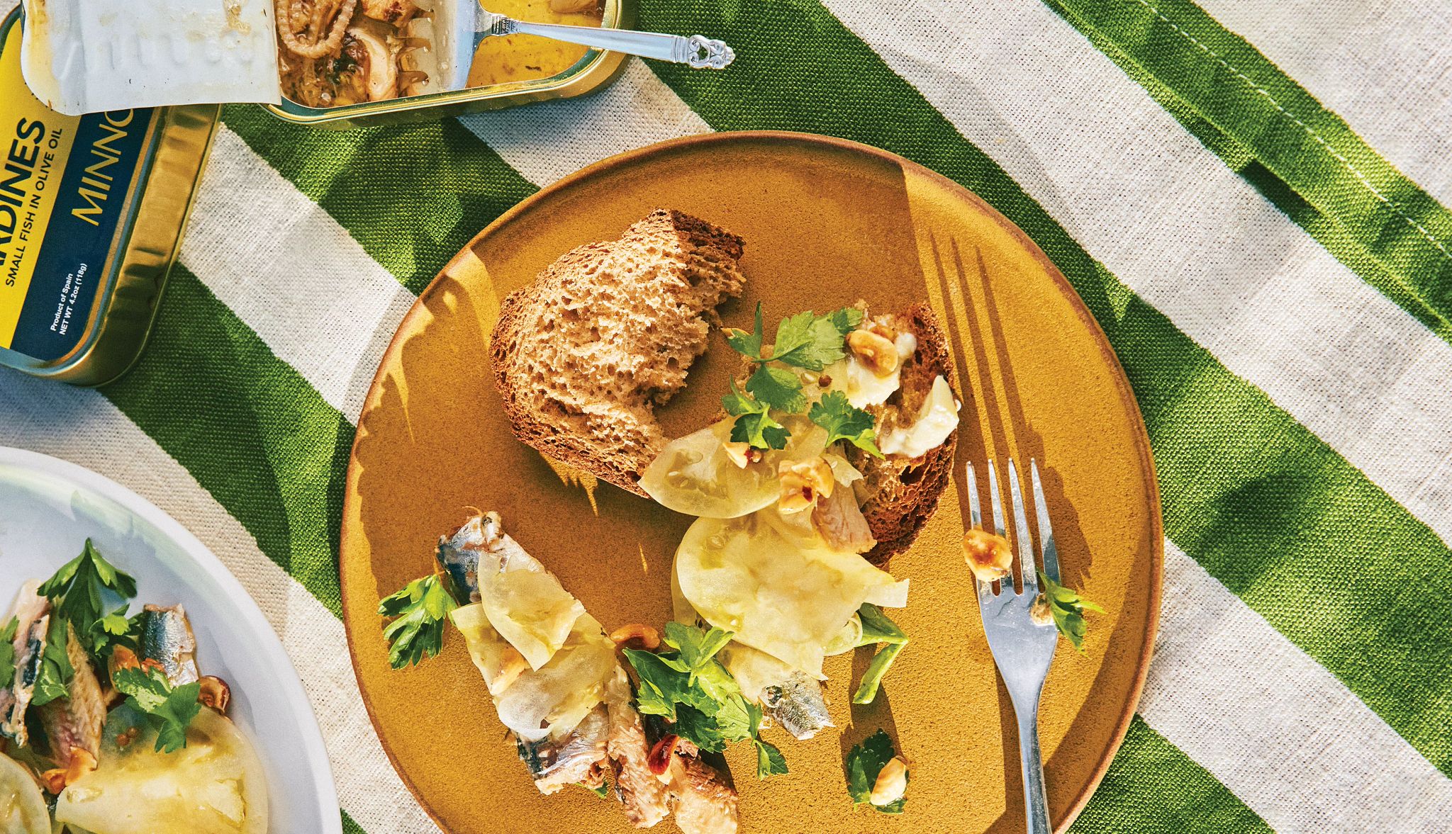 Dressed-Up Tinned Fish Dressed-Up Tinned Fish with piece of bread and fork on plate