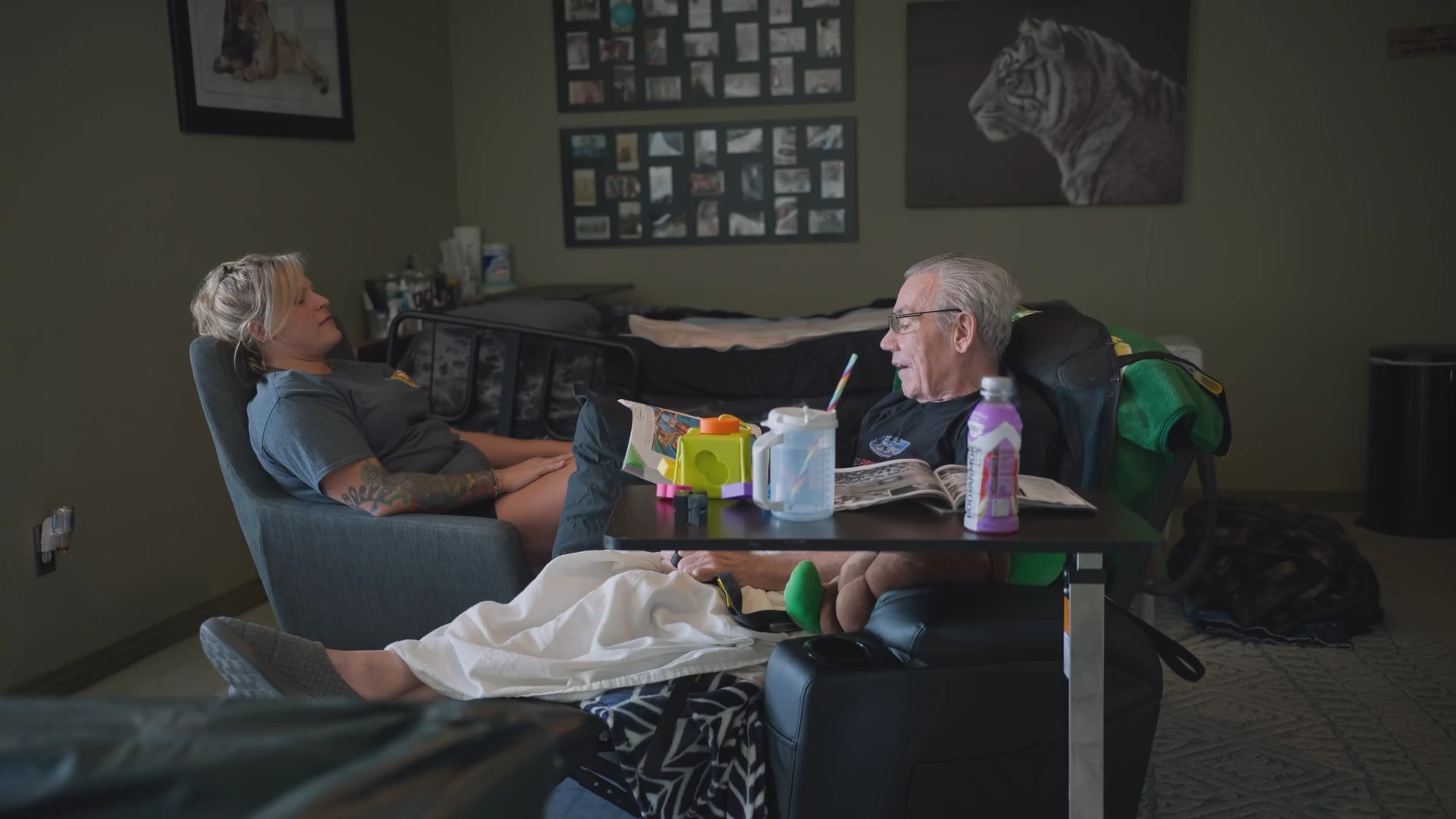a woman sits with her father in a room of their home