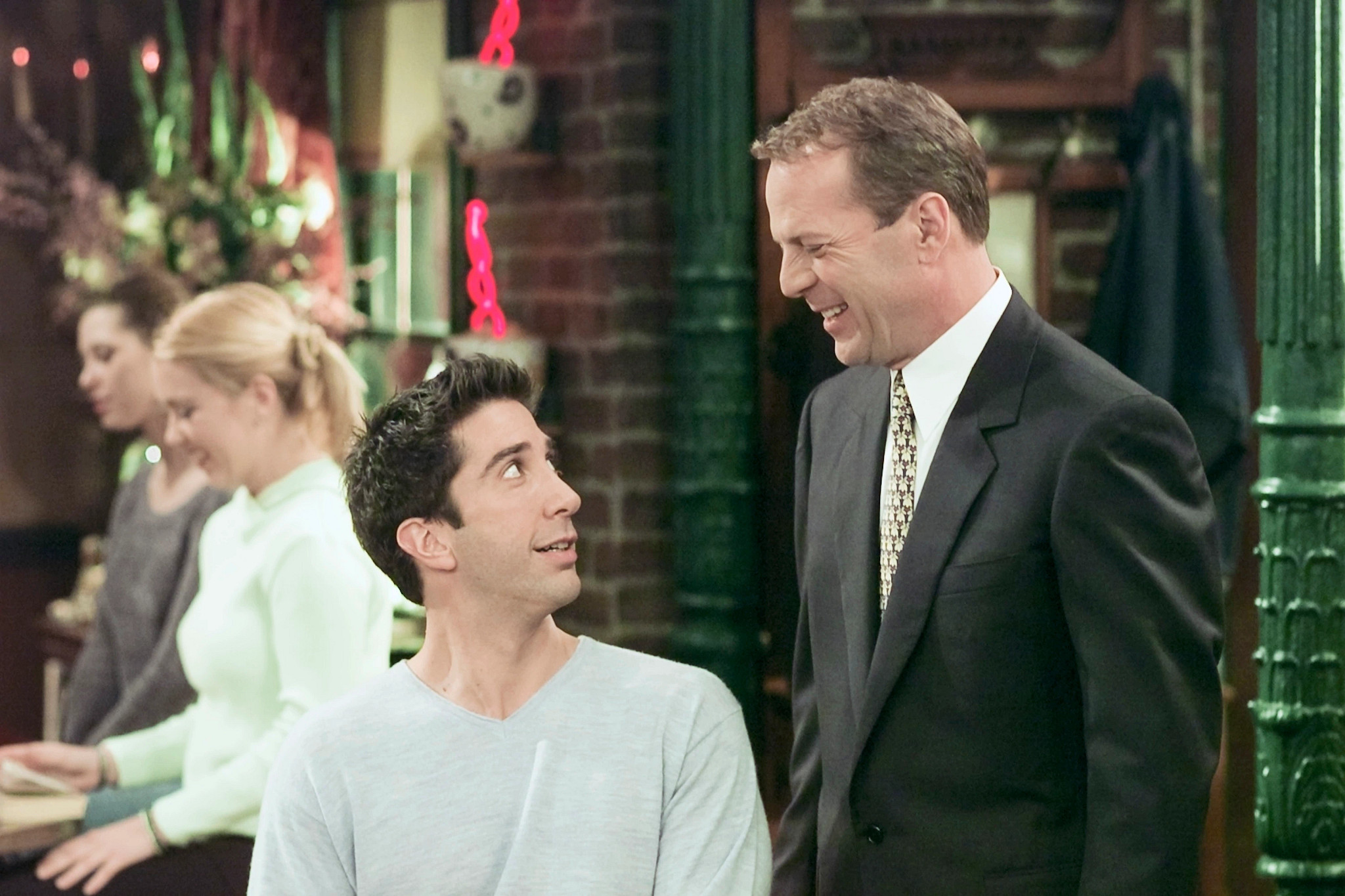 david schwimmer and bruce willis in a scene from an episode of friends
