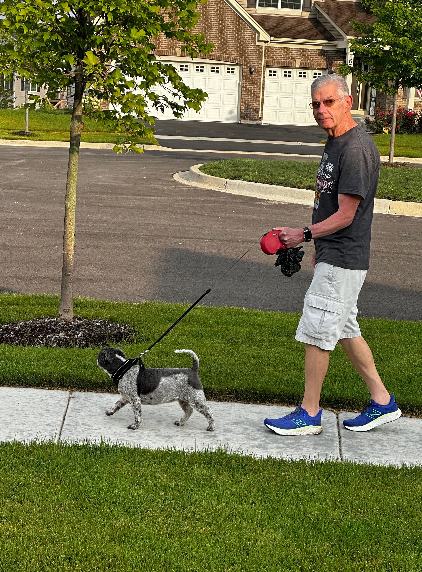 Doug Nichols heads out for a walk with his dog, Gracie