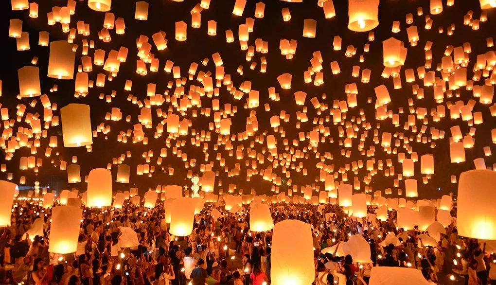 Learning about other holidays can expand thinking and boost creativity People launching floating lanterns at a Yi Peng festival