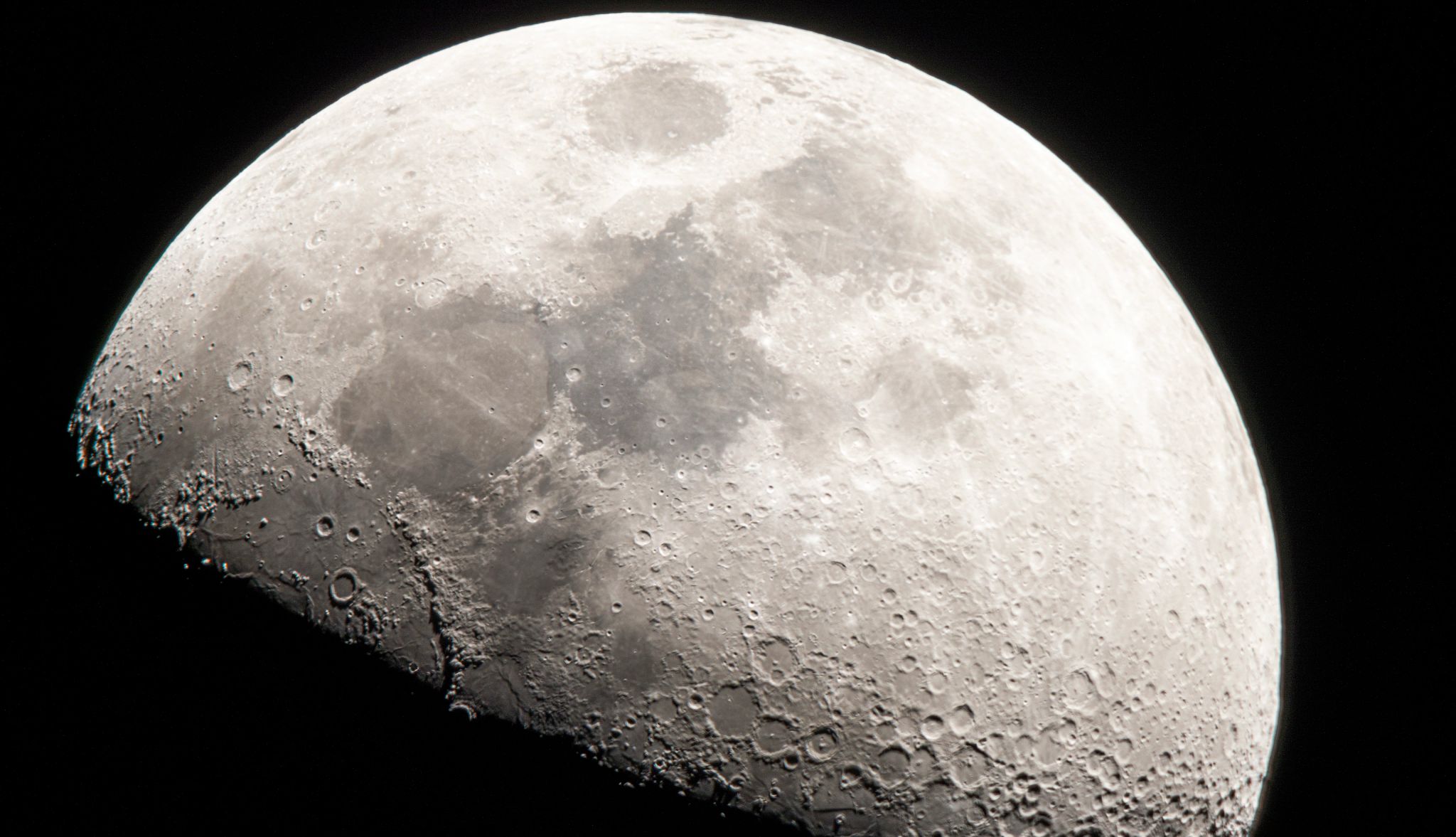 Closer view of moon The moon's face, a story in shades of gray.