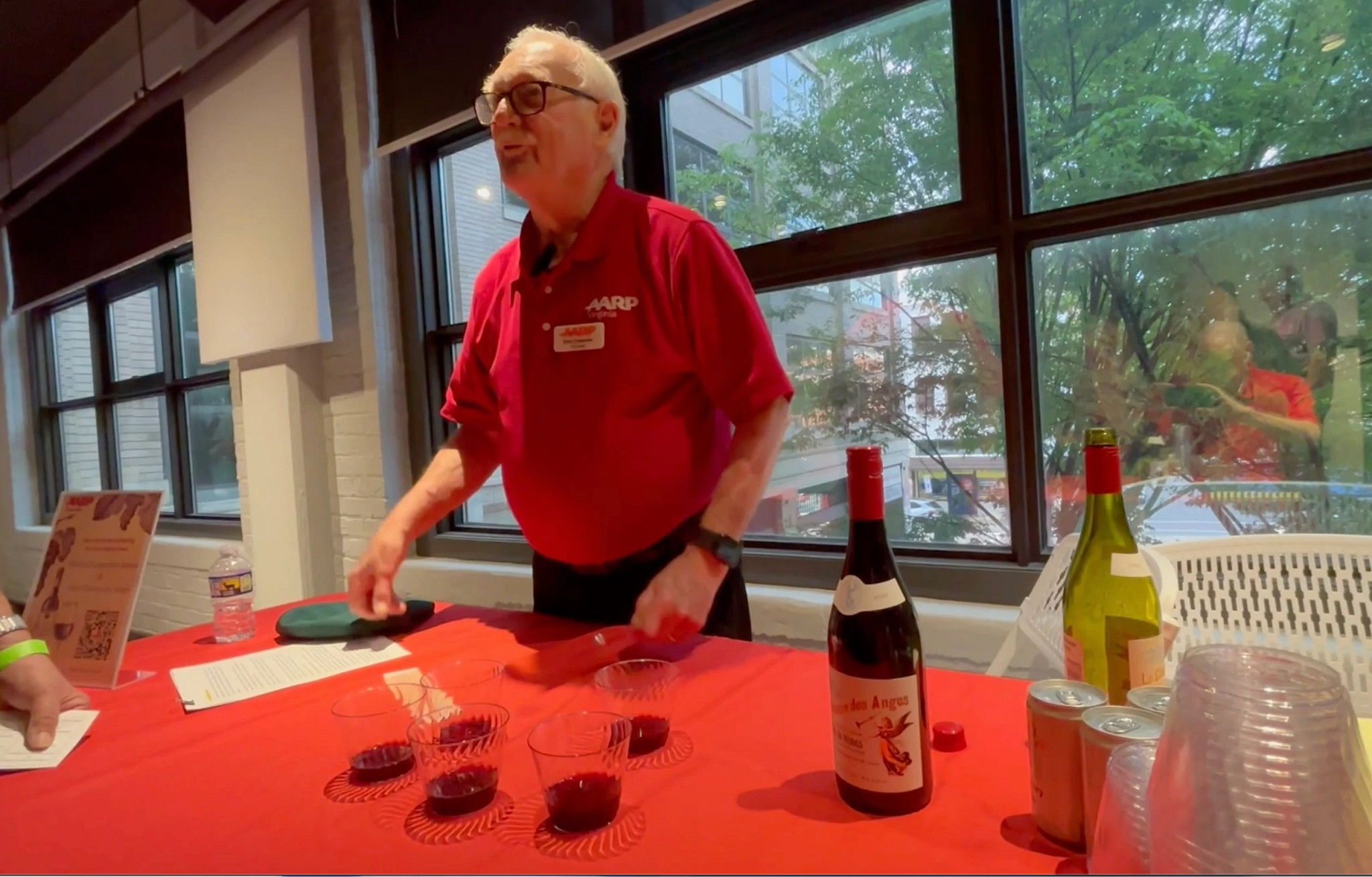 a man pouring wine at a table
