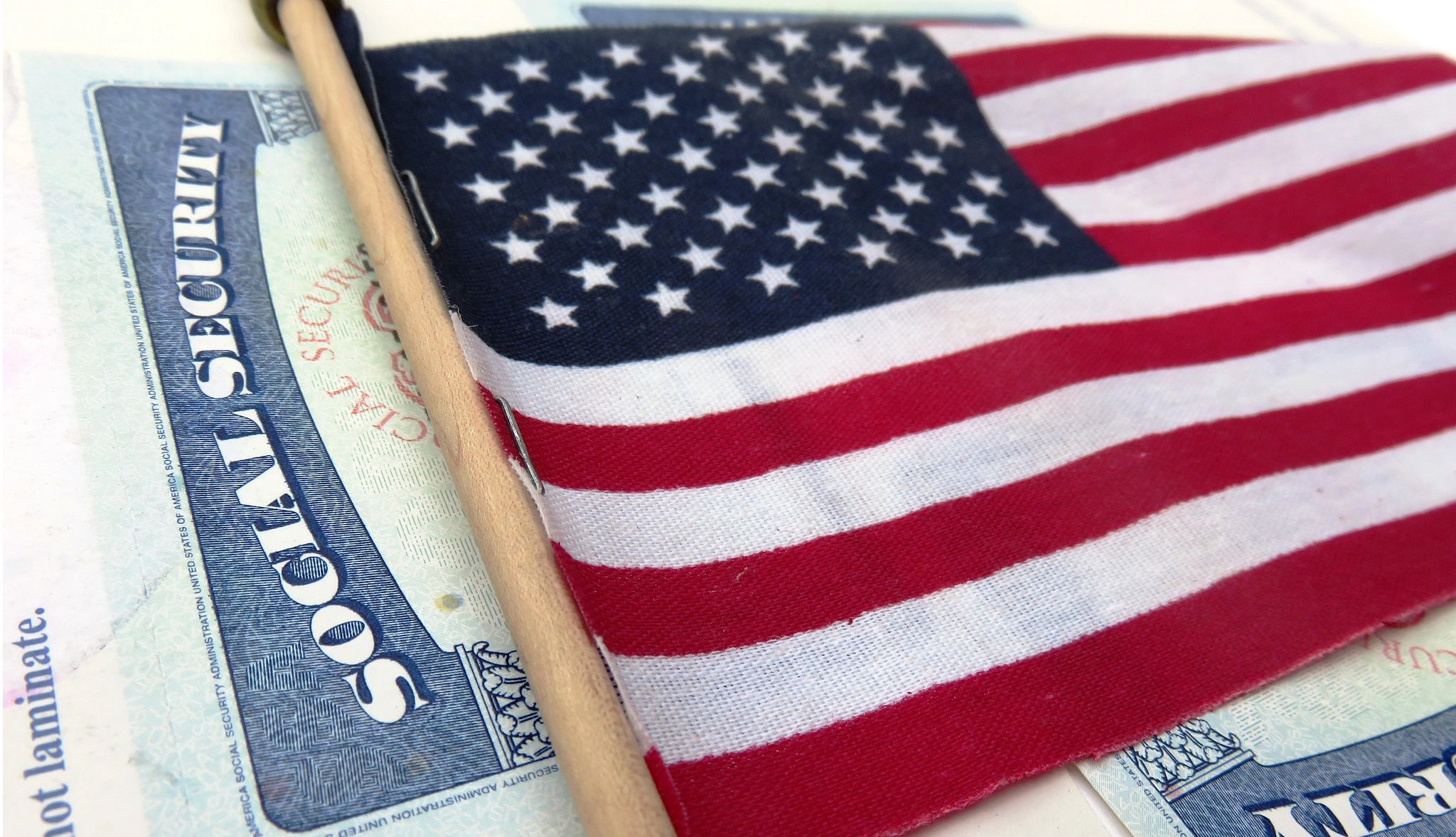 American flag overlayed on Social Security card American flag overlayed on Social Security card