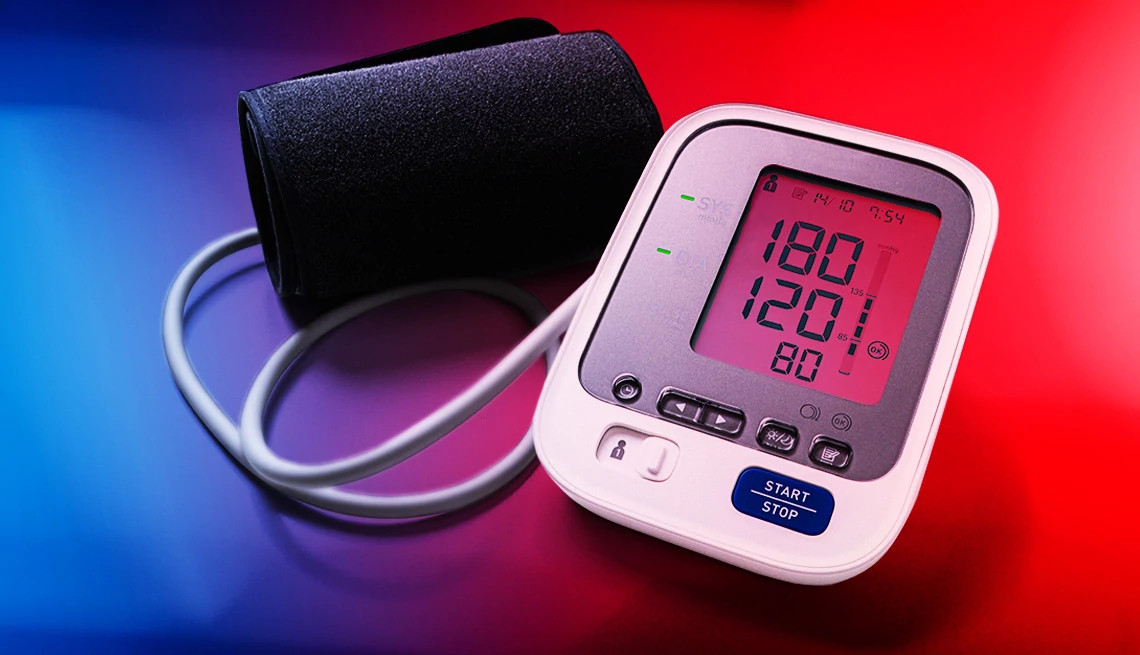a blood pressure cuff showing a high blood pressure of 180/120