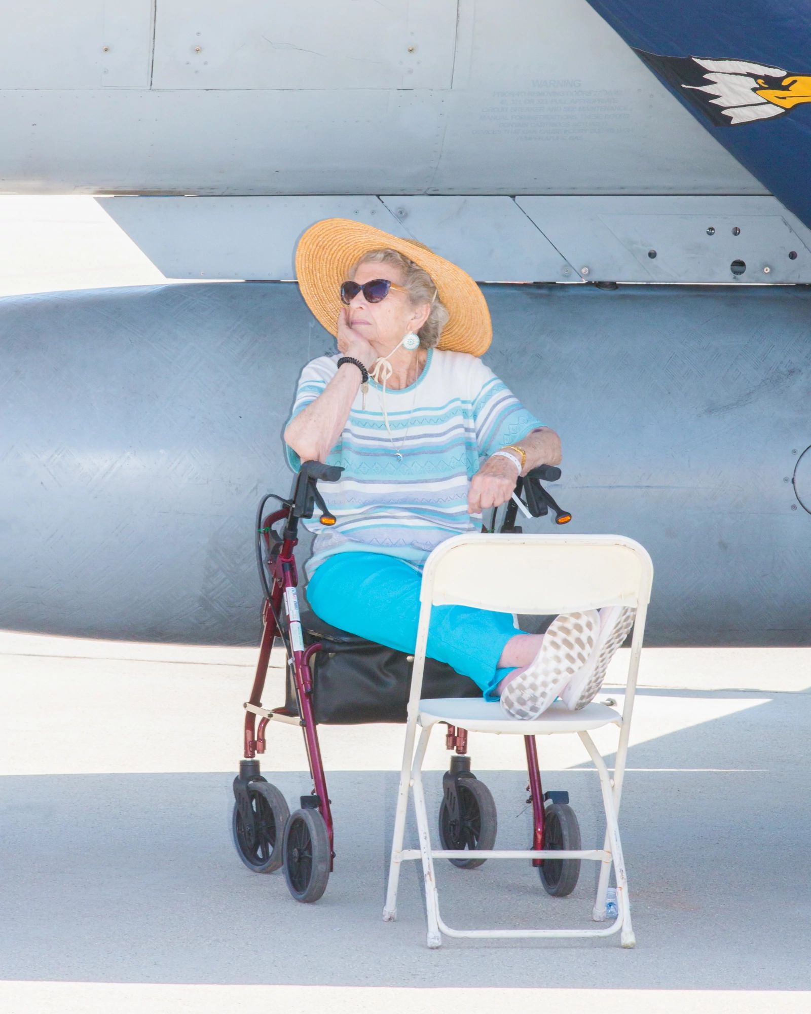 Blue Angels A spectator sits in the shade at an air show