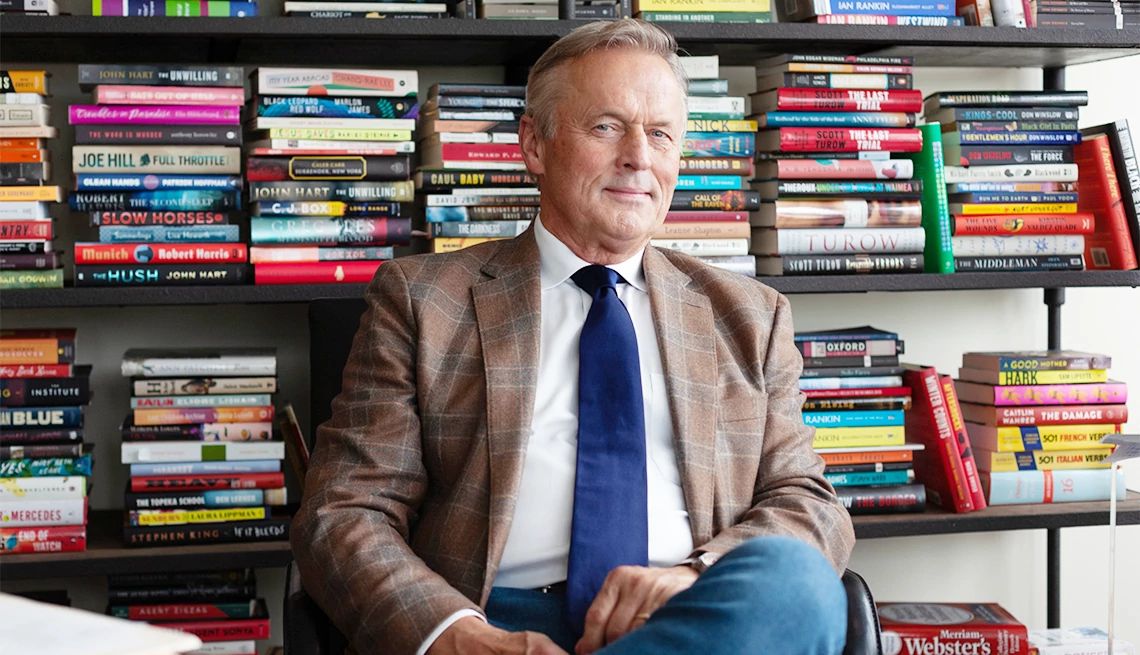 author John Grisham John Grisham in front of books