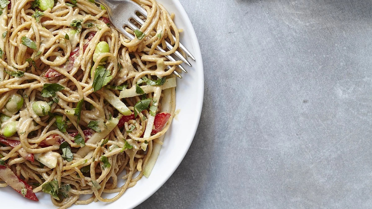A close-up view of Thai peanut curry noodles on a plate